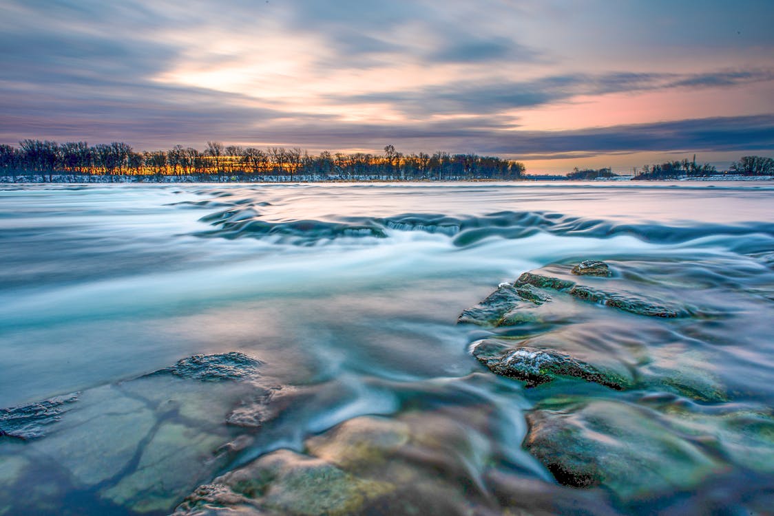 Serene Sunrise Over River in Quebec Landscape · Free