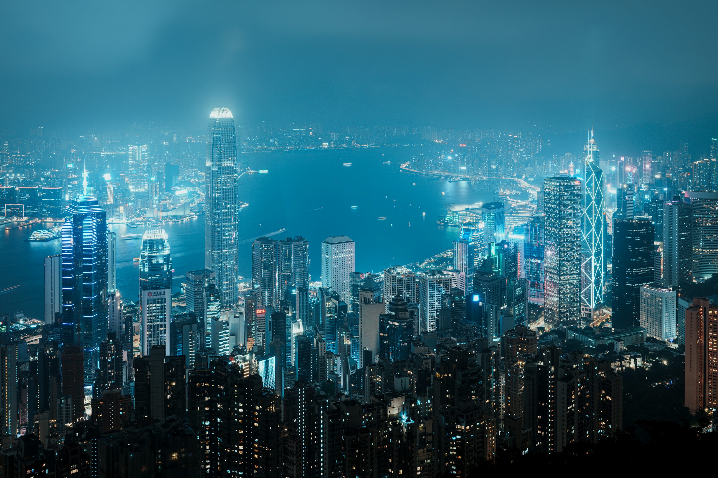 A view of a city at night from the top of a hill photo