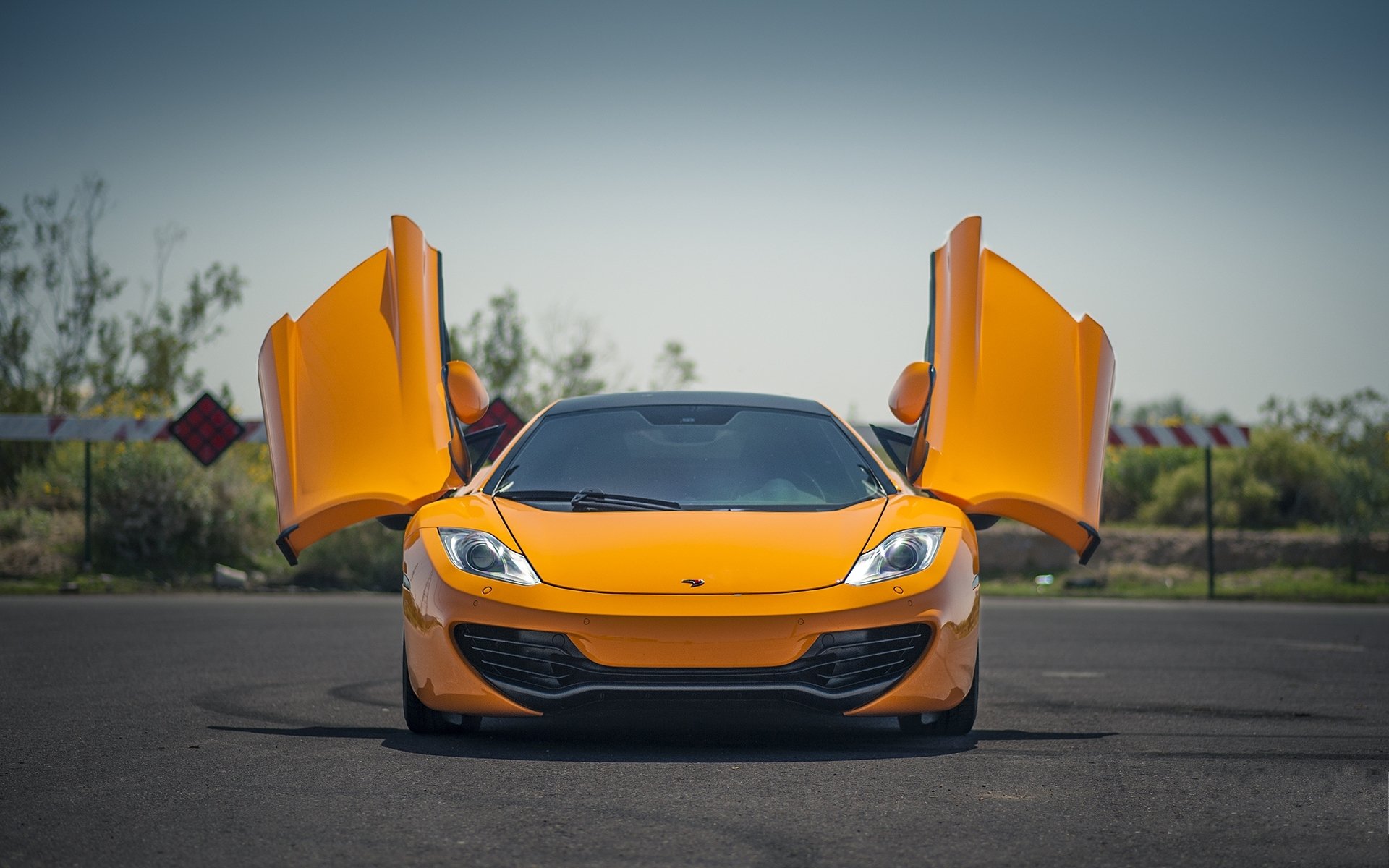 Mclaren Mp4 12c Orange With Open Doors For Your Phone