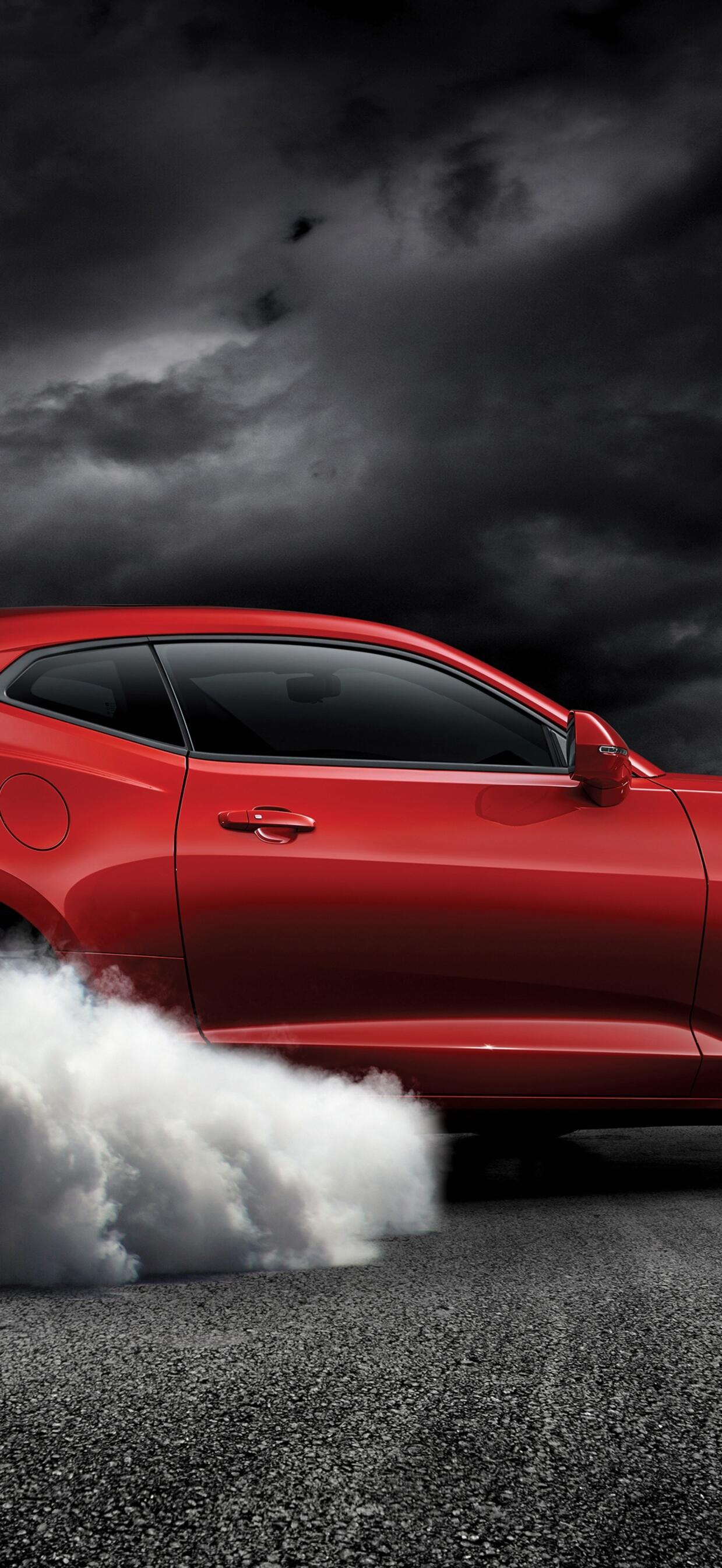 Drifting in place on a red chevrolet camaro ss. · 1242x2688 iPhone XS Max free photo from chappie and wallpaper