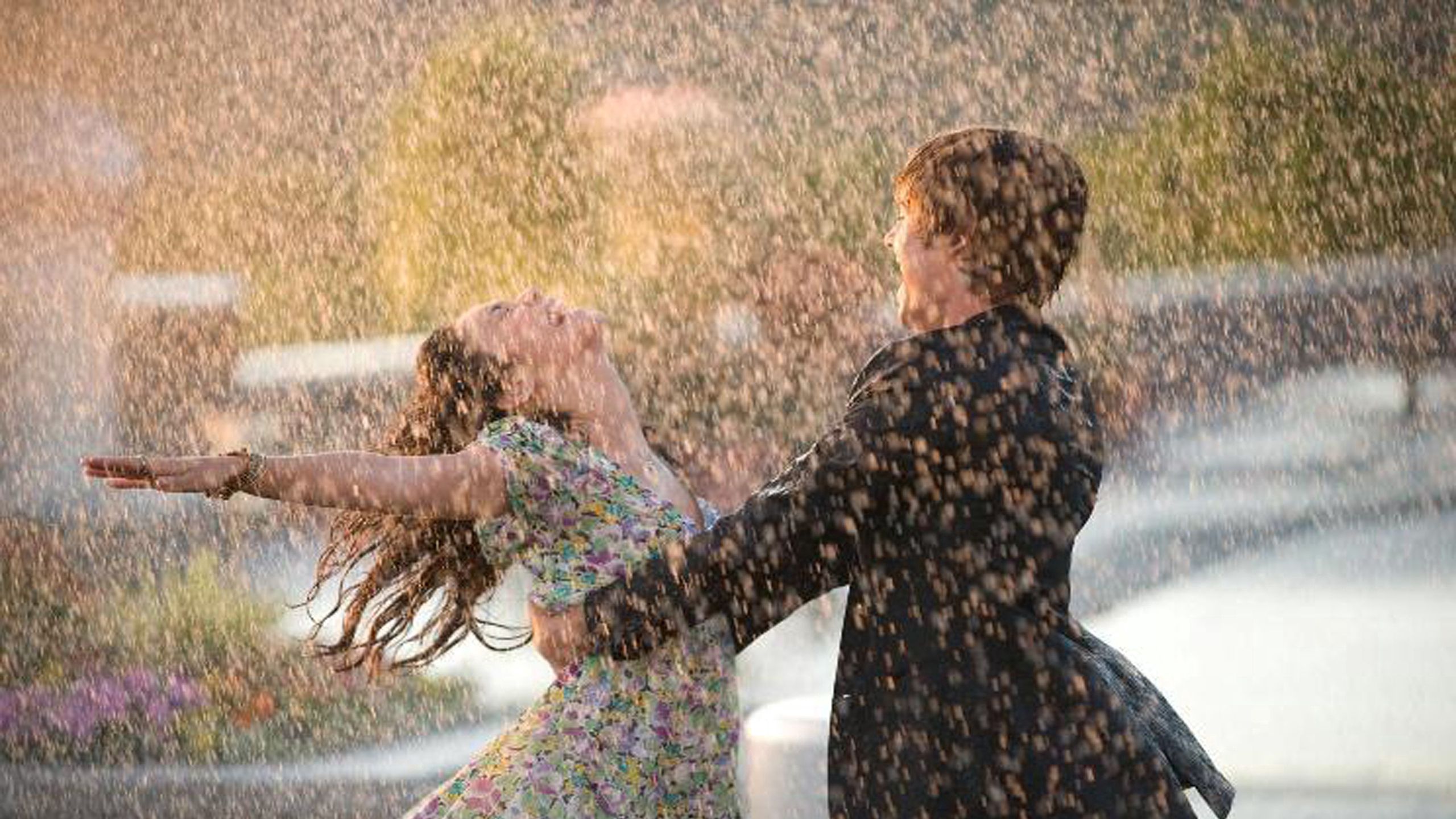 Download wallpaper 2560x1440 couple, dance, happiness, rain, wet, love widescreen 16:9 HD background