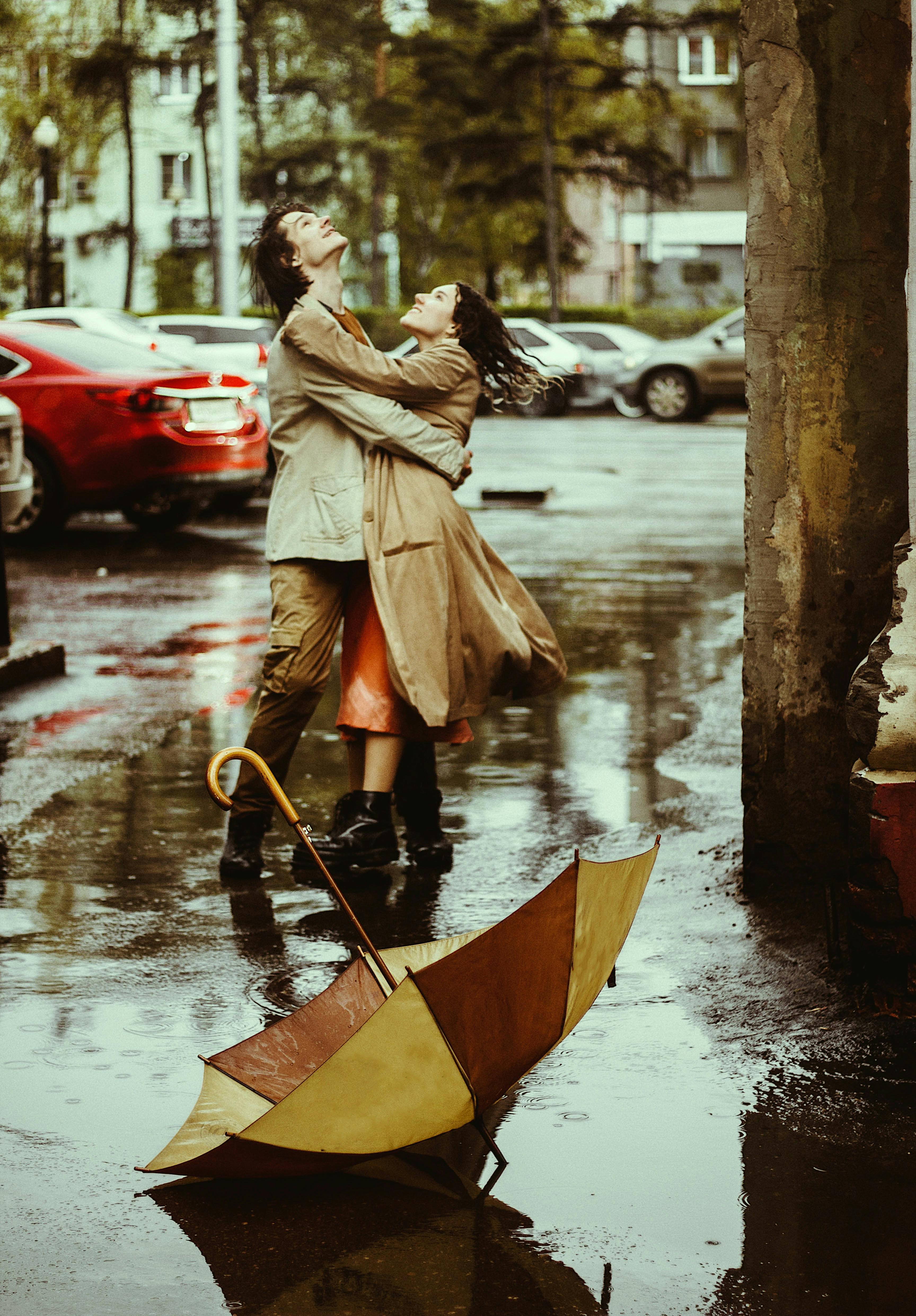 Man and Woman Hugging in the Rain · Free