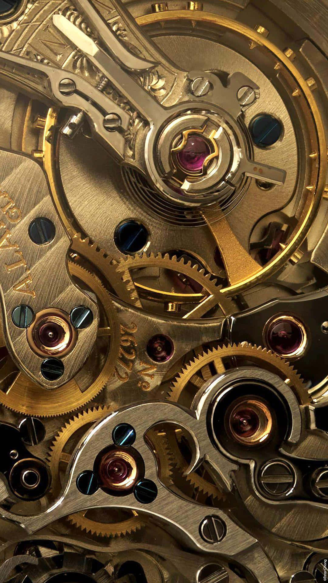 Download Intricate Watch Mechanism Closeup Wallpaper