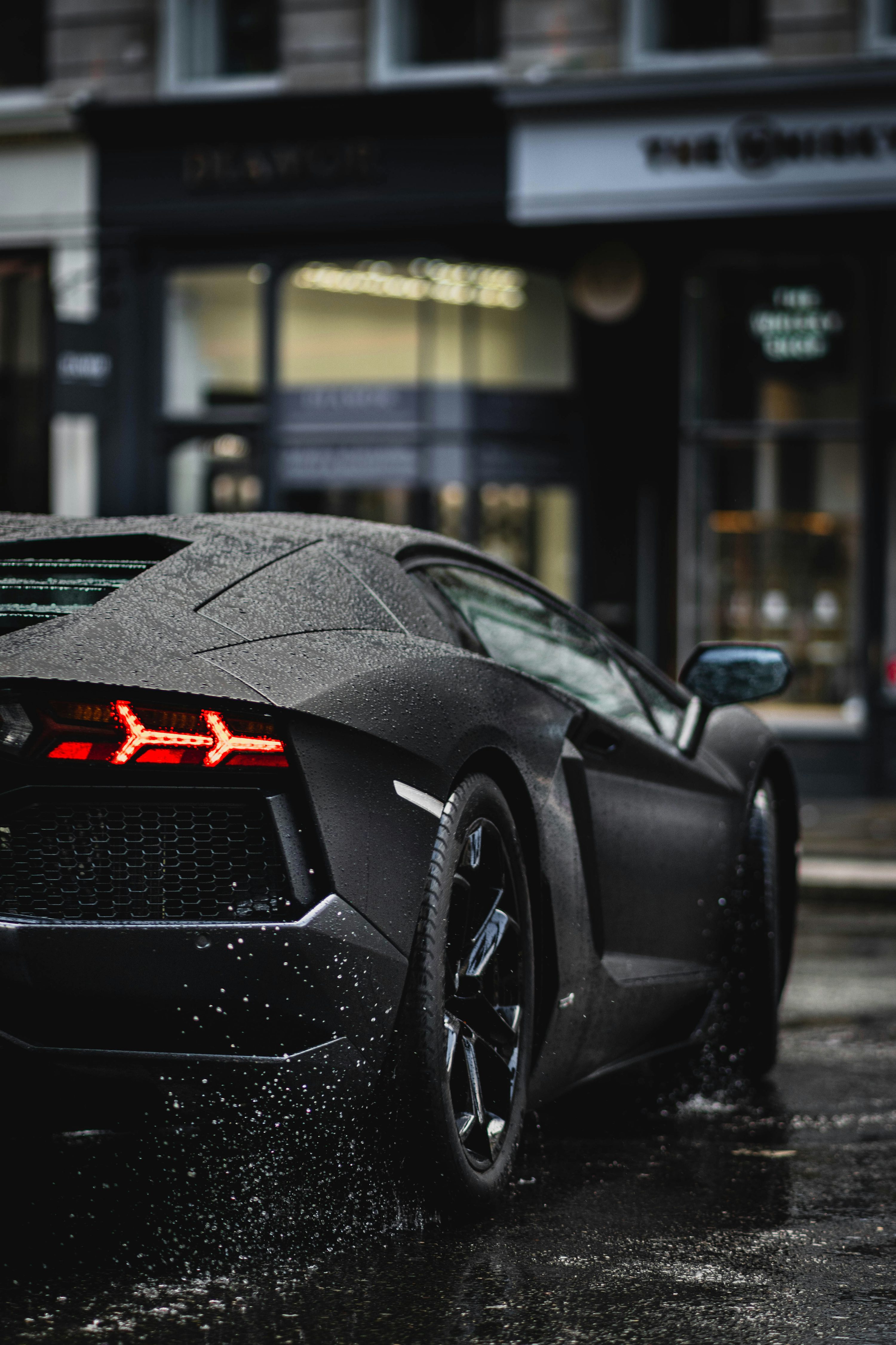 Black porsche 911 parked on street during daytime photo