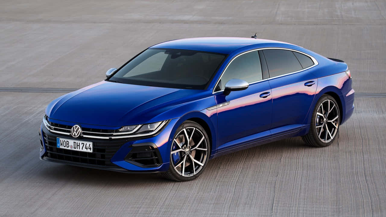 Download Caption: Stunning Volkswagen Arteon In Urban Landscape Wallpaper