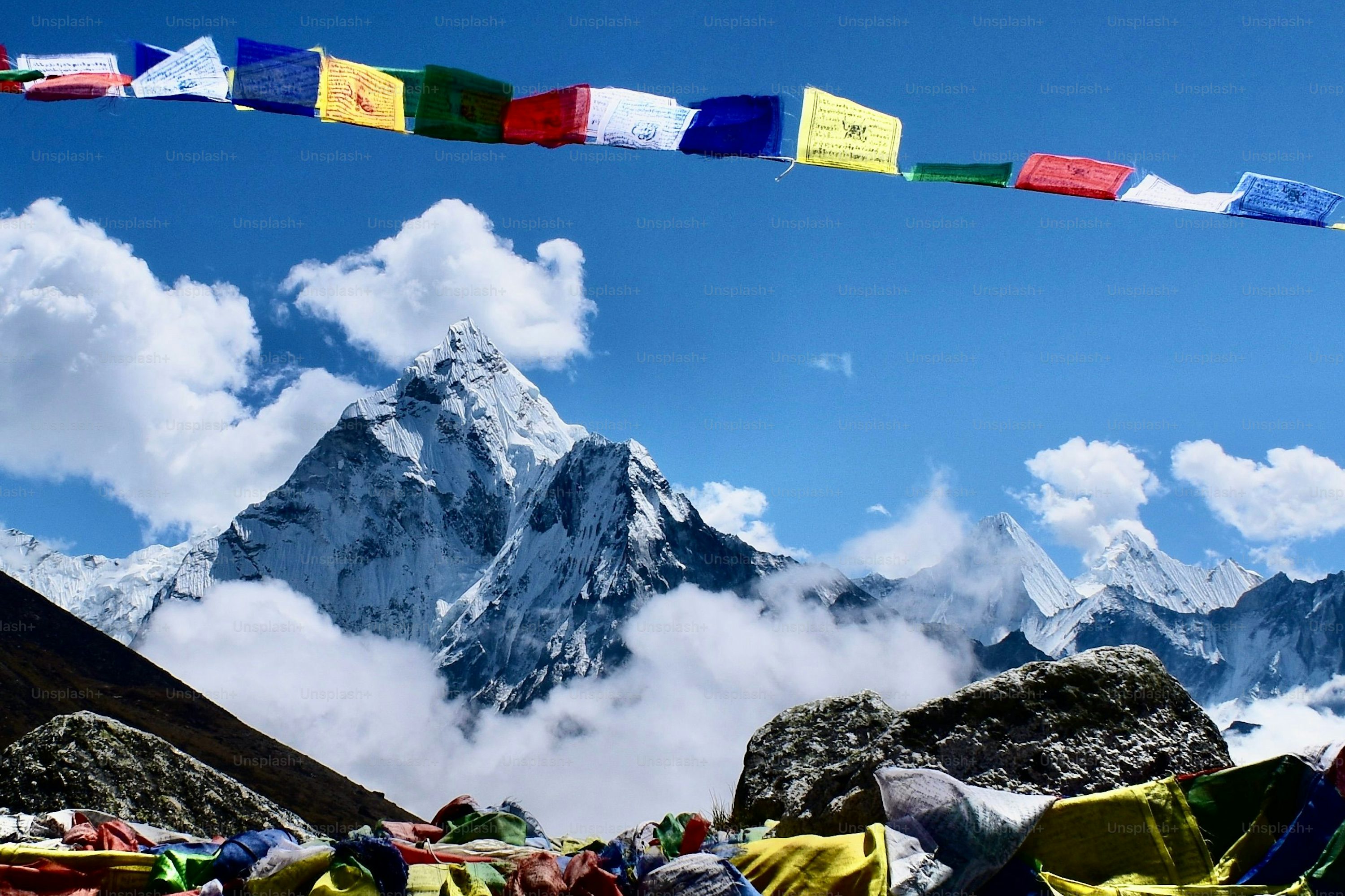 A beautiful shot of mount Everest with prayer flags in the foreground photo