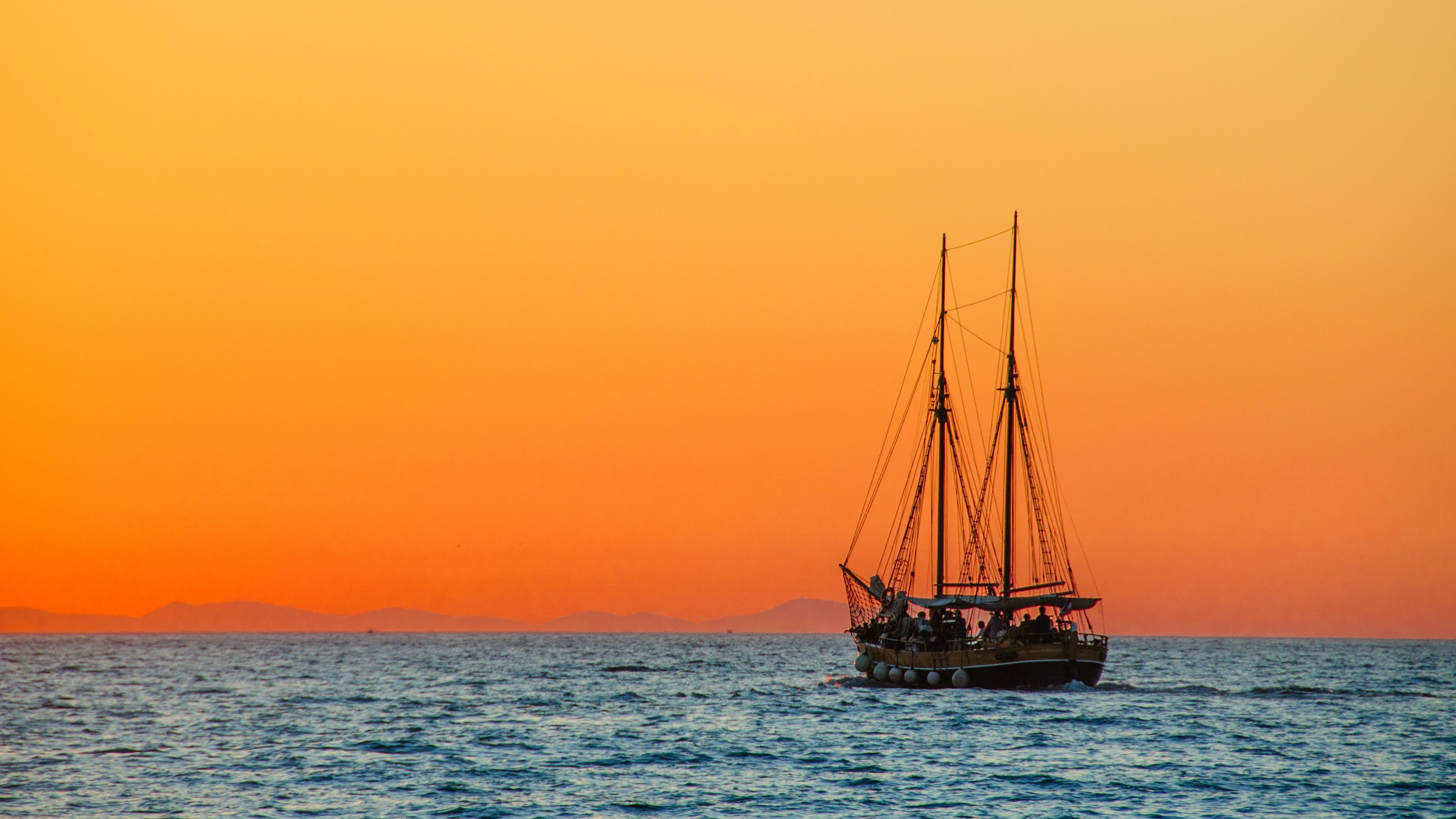 Download wallpaper 3840x2160 sea, sailing, boat, sunset 4k uhd 16:9 HD background