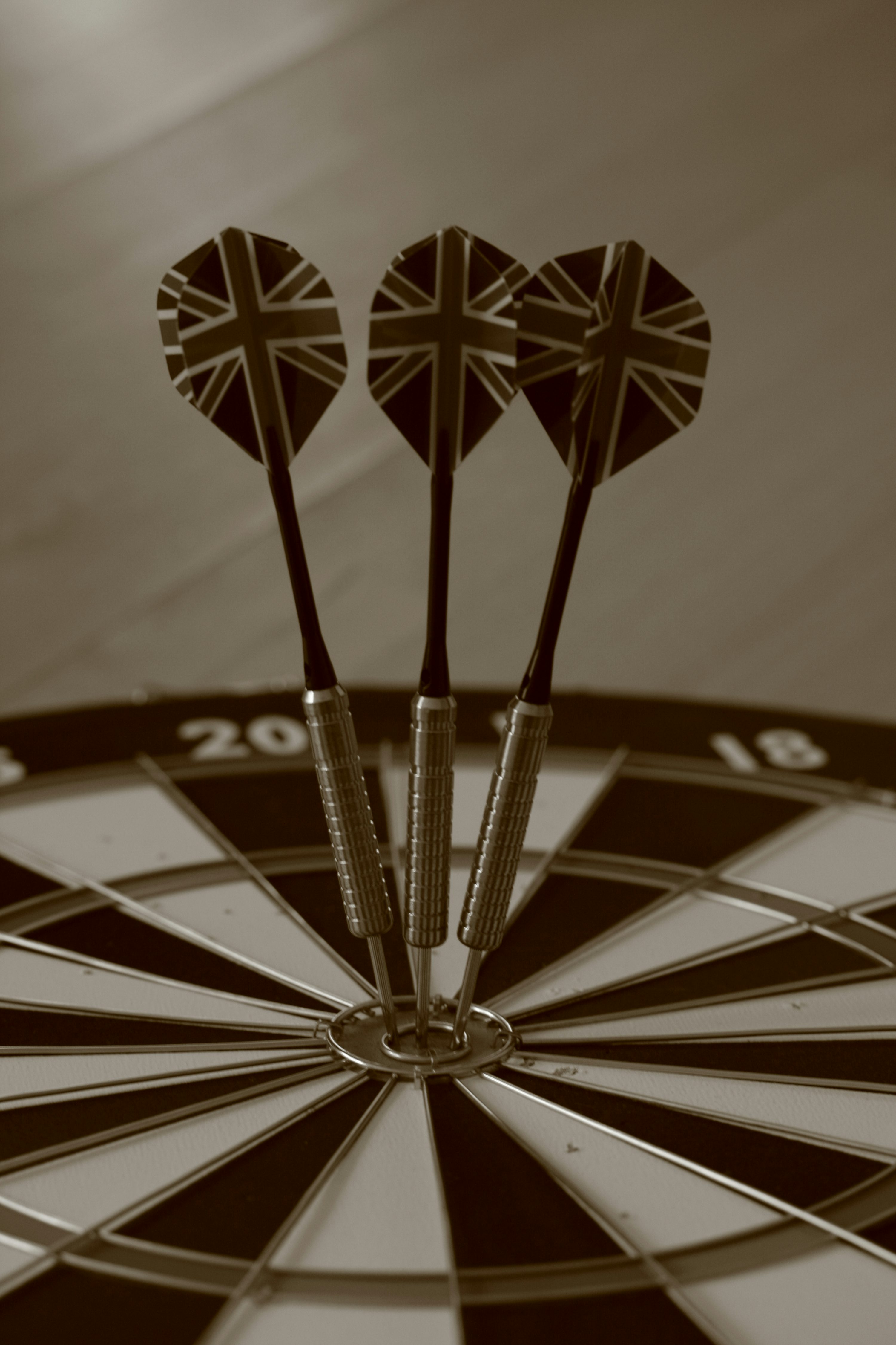 Three darts in the center of a dart photo