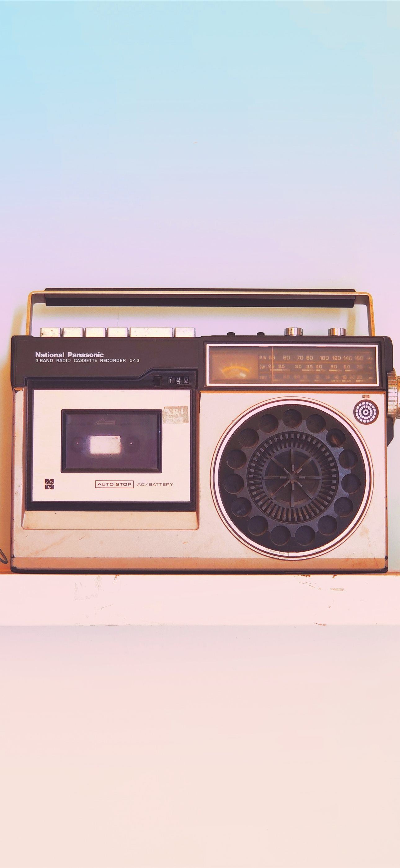 brown and black radio on white table iPhone Wallpaper Free Download