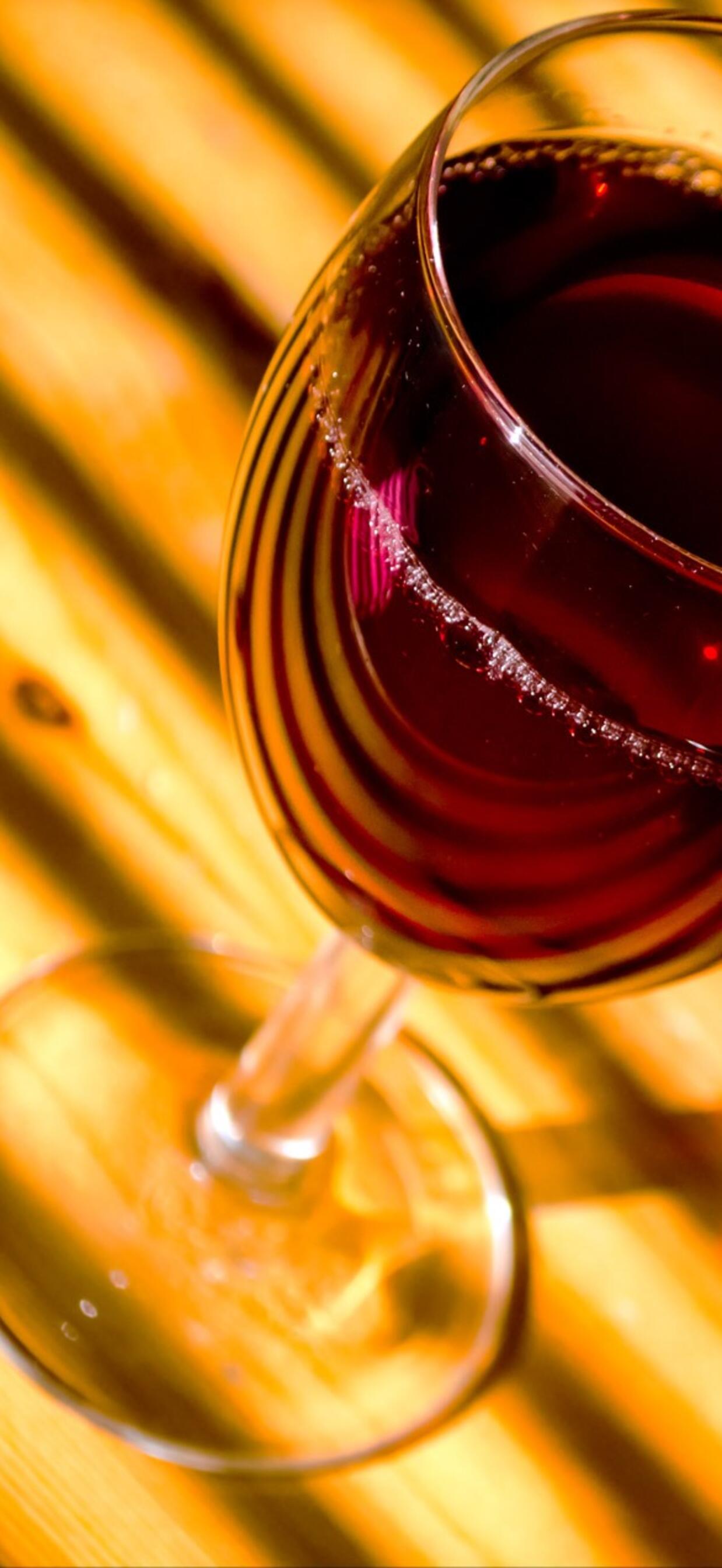 Red wine in a glass · 1242x2688 iPhone XS Max free photo from uaha and wallpaper