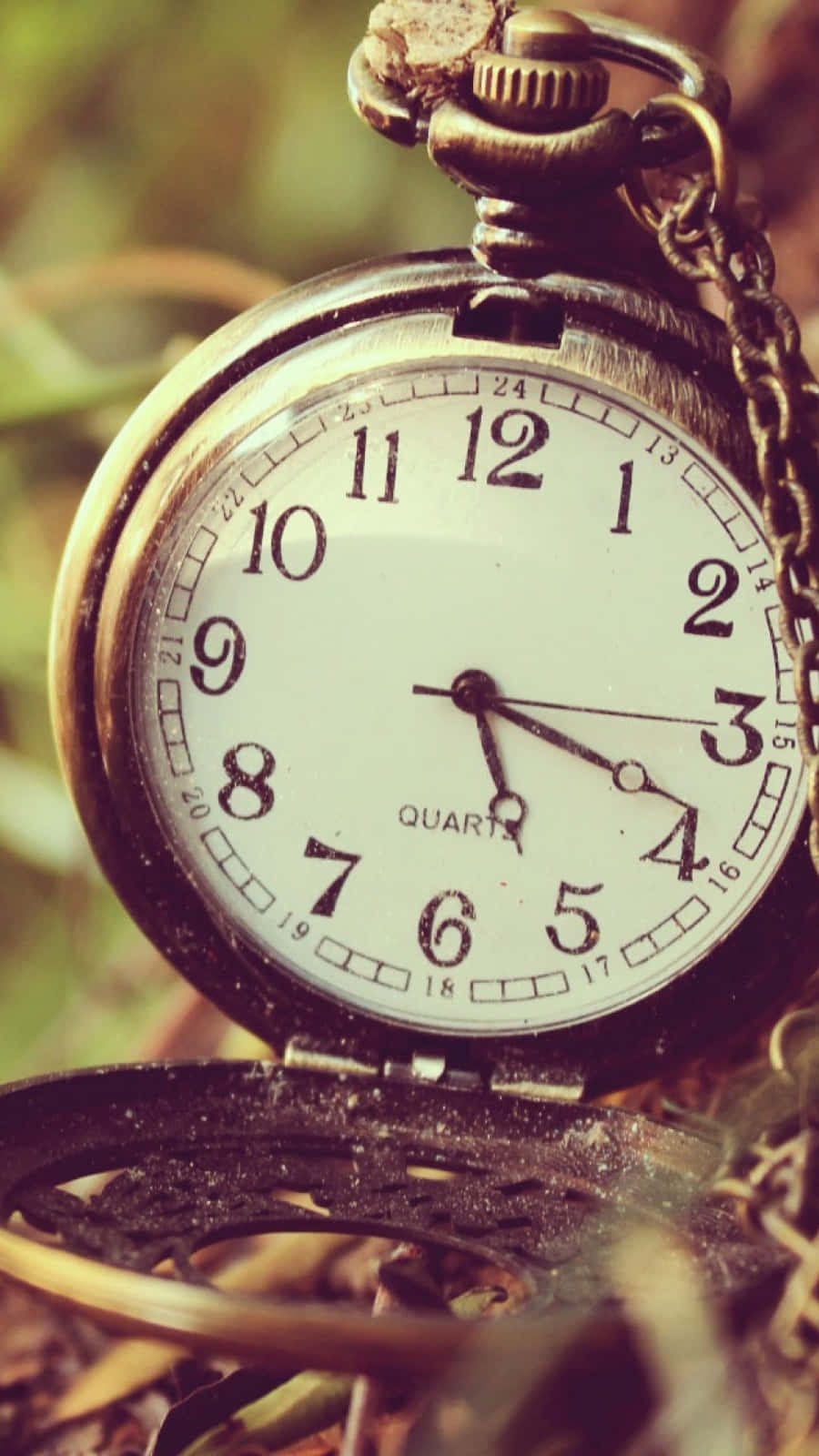 Download Pocket Time Clock On The Ground Wallpaper