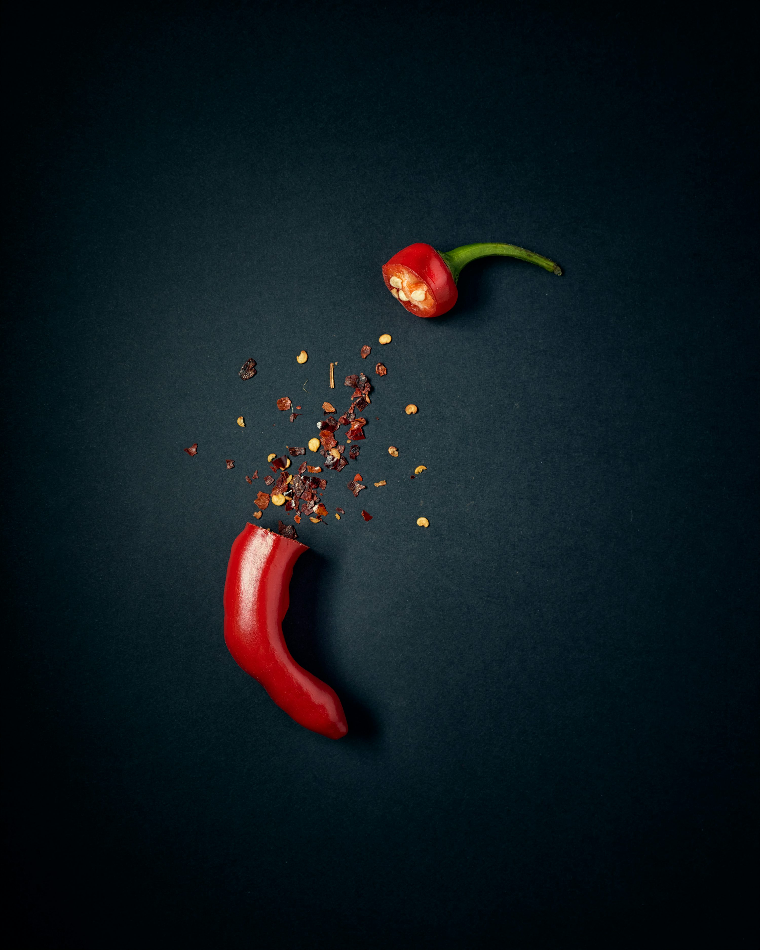 Red chili pepper with green leaves photo