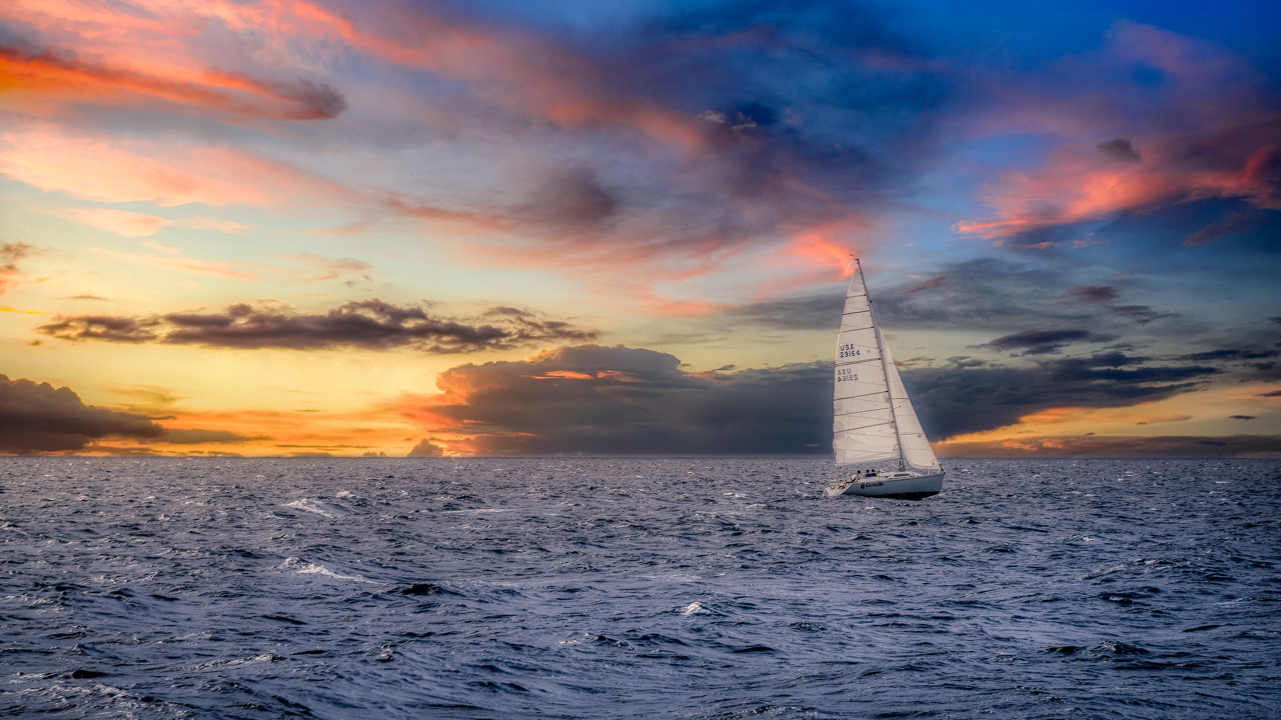 Download wallpaper 2560x1440 sailboat, sunset, sea, horizon widescreen 16:9 HD background
