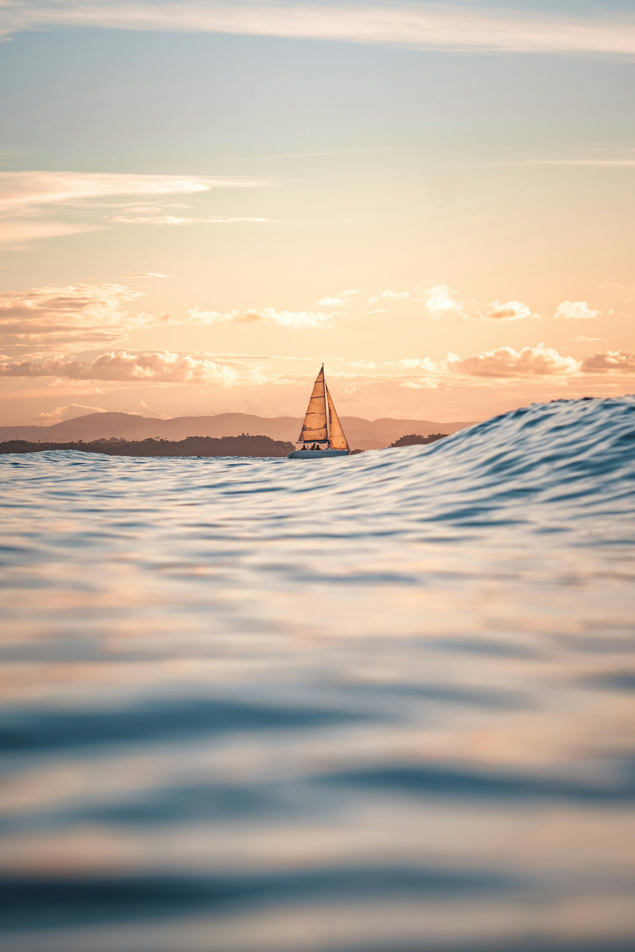 Sailboat Sailing at Sea during Sunset · Free
