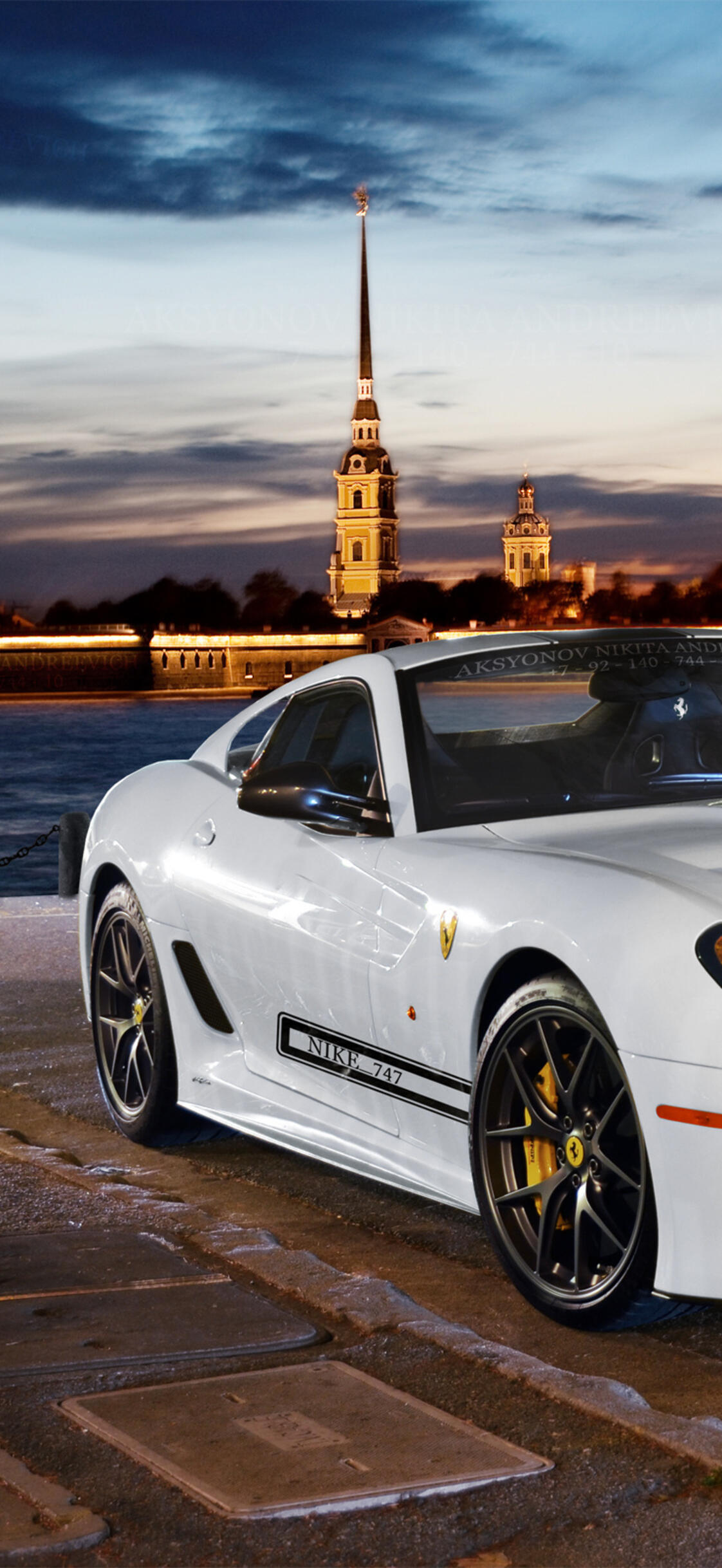 White ferrari 599 gtb fiorano in the background of the city · 1125x2436 iPhone XS free photo from uaha and wallpaper