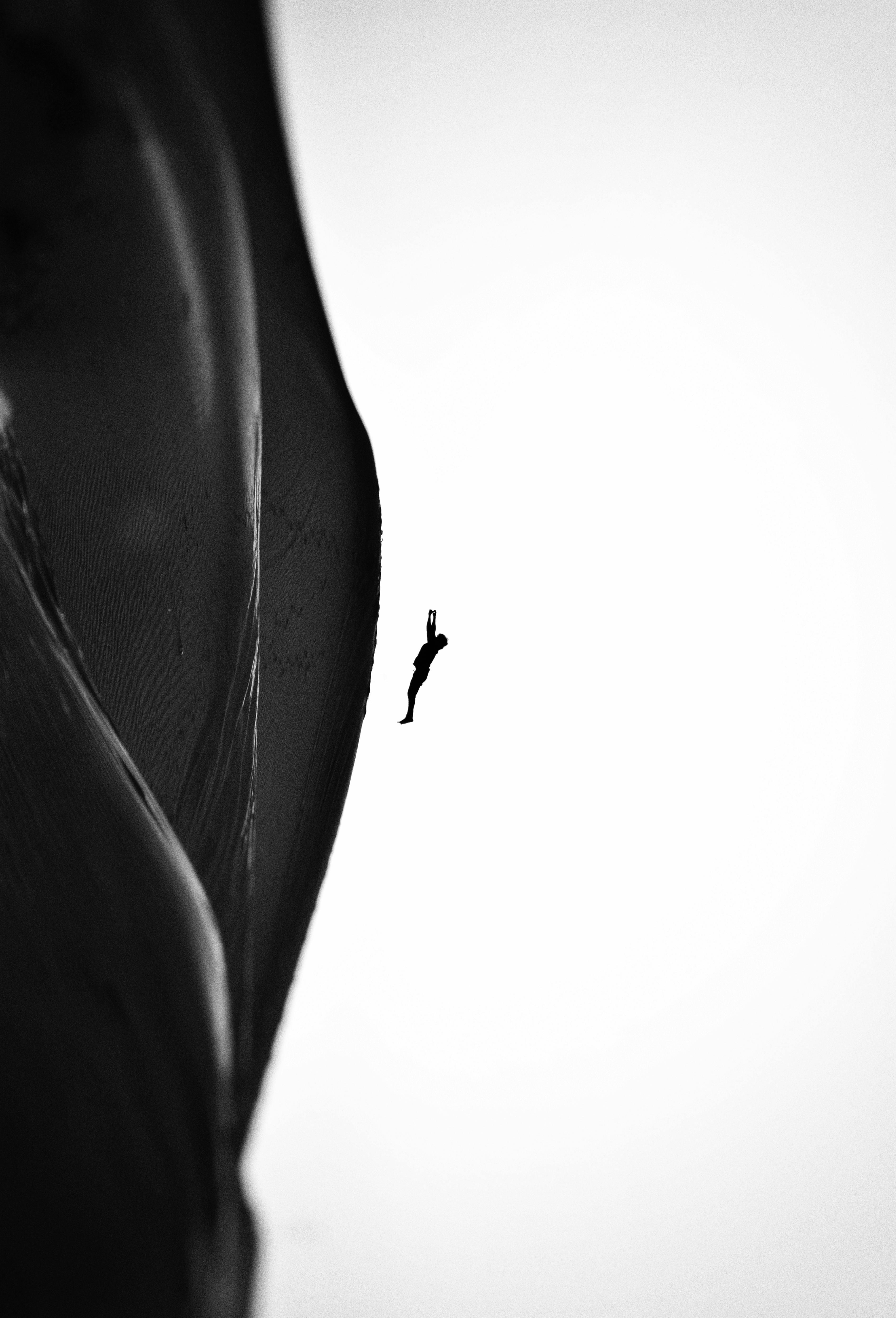 Grayscale Photo of a Person Falling · Free