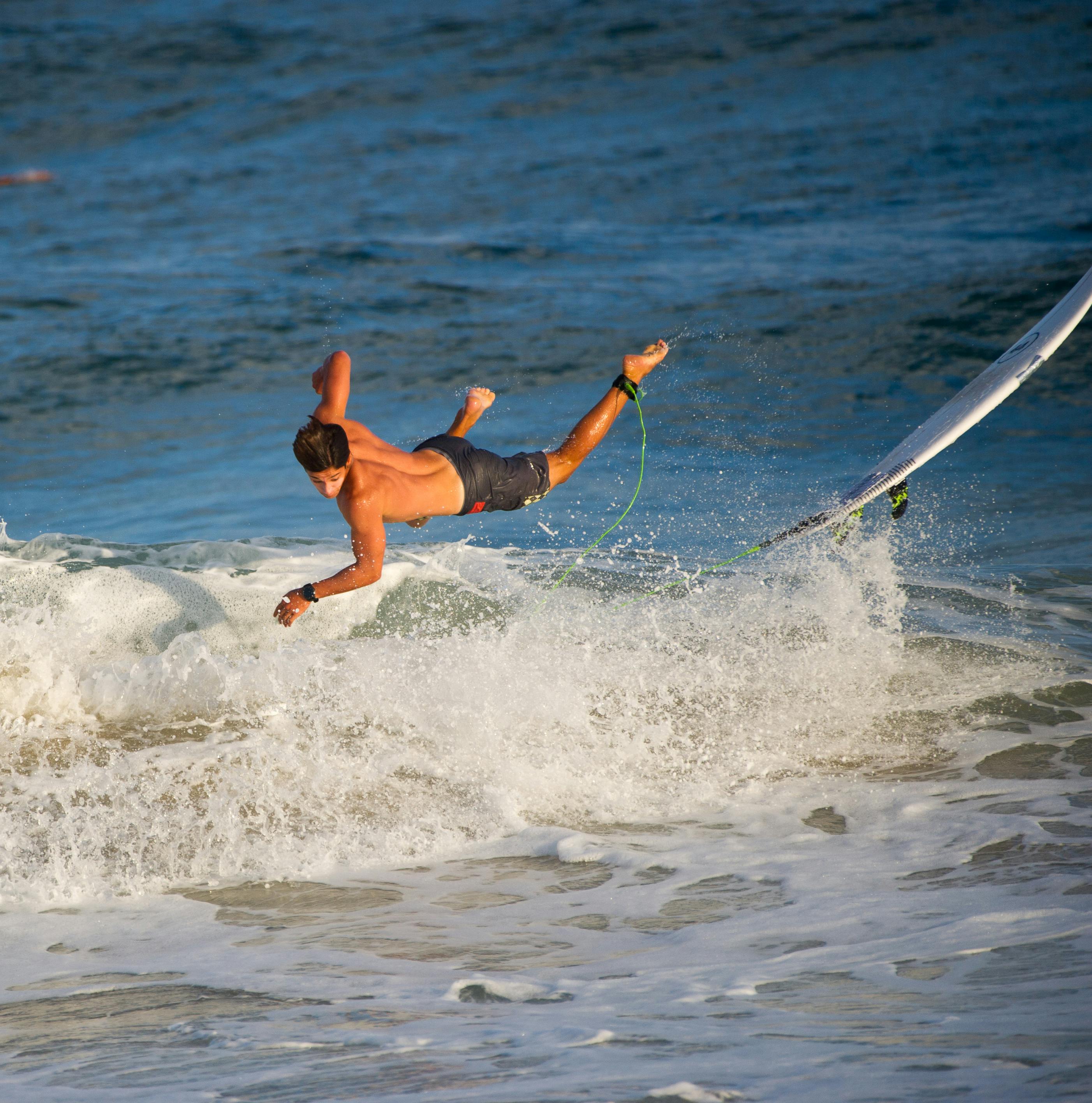 A Man Falling Off a Surfboard · Free