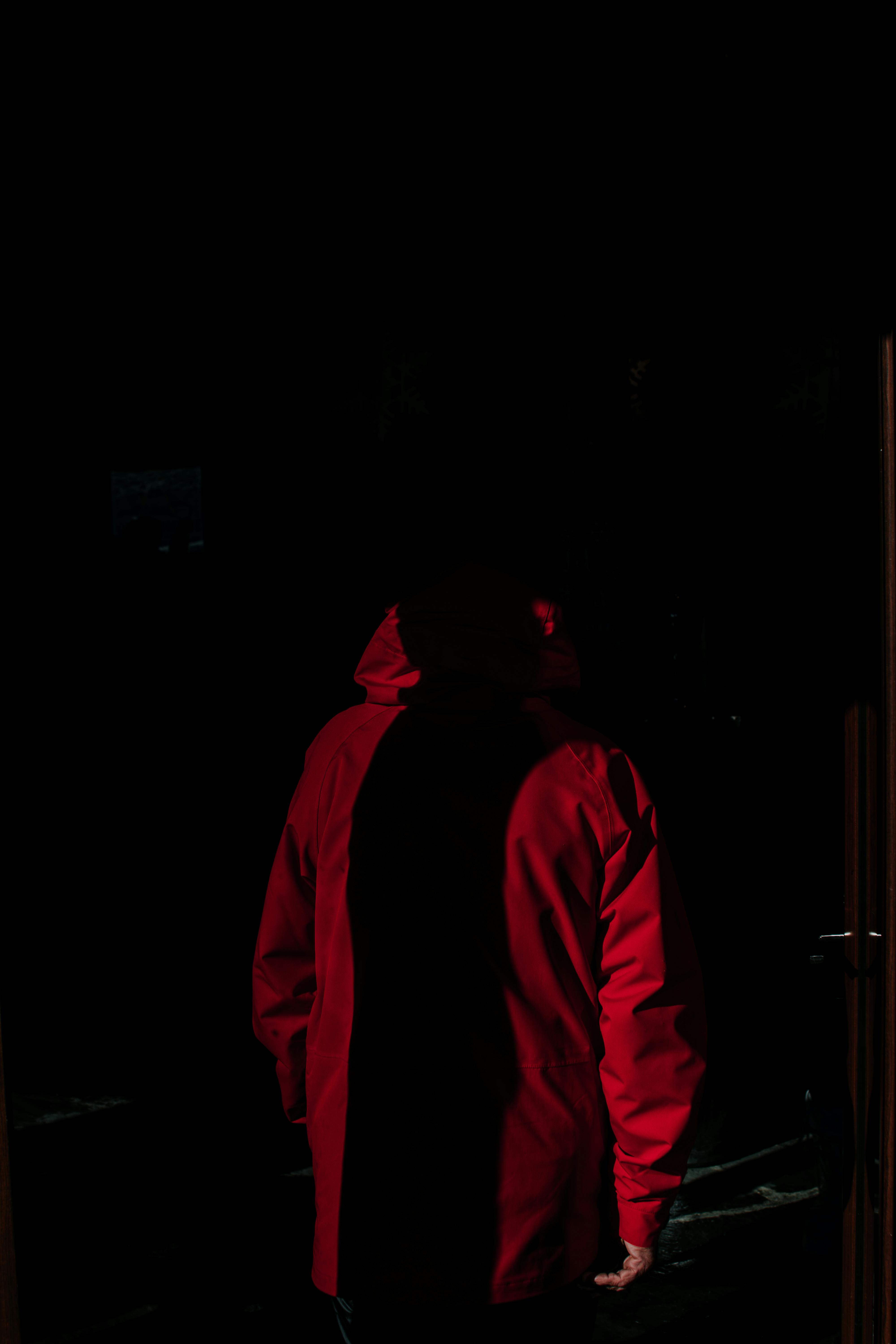 Man in Red Jacket Standing in Dark · Free