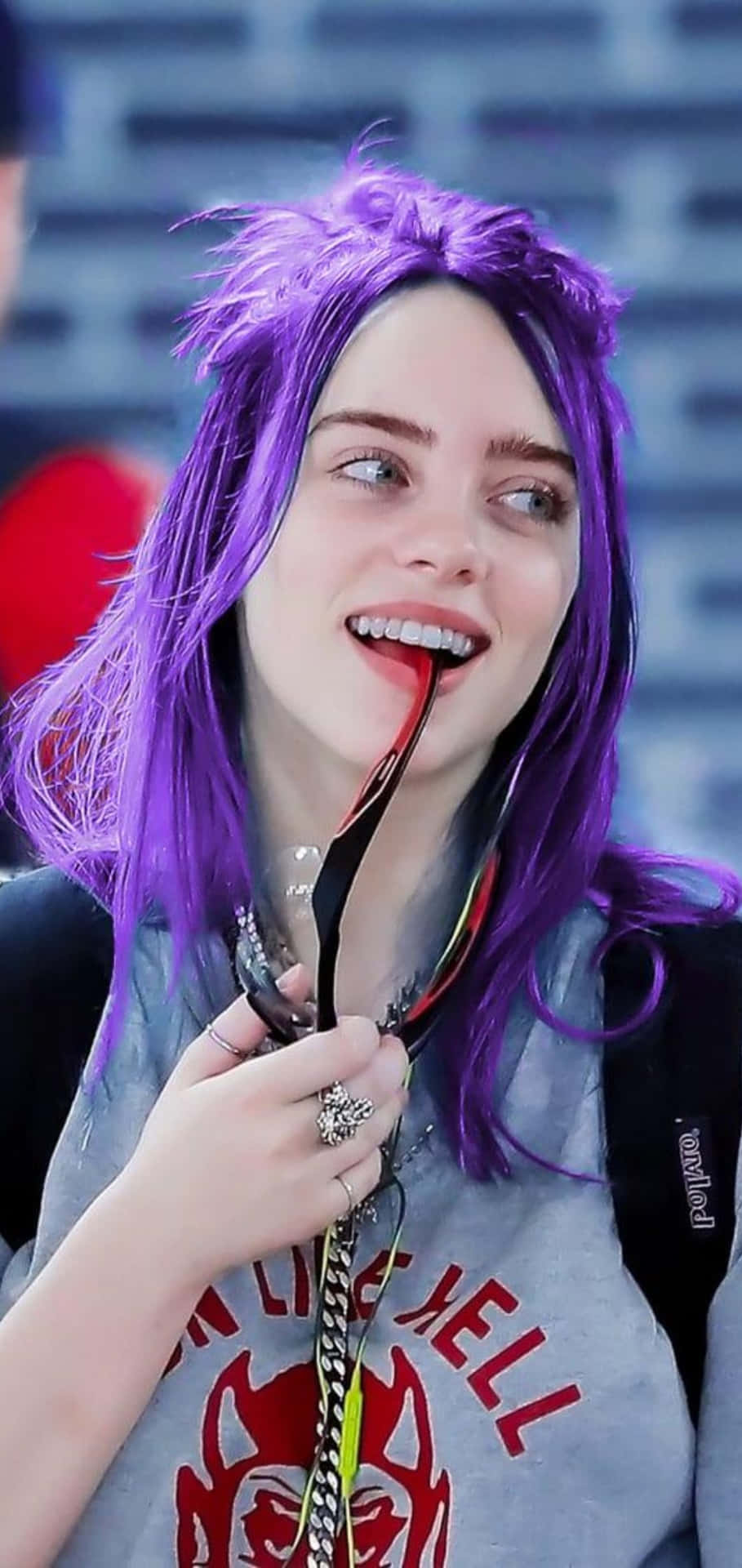 Download Billie Eilish In A Swathe Of Purple Wallpaper