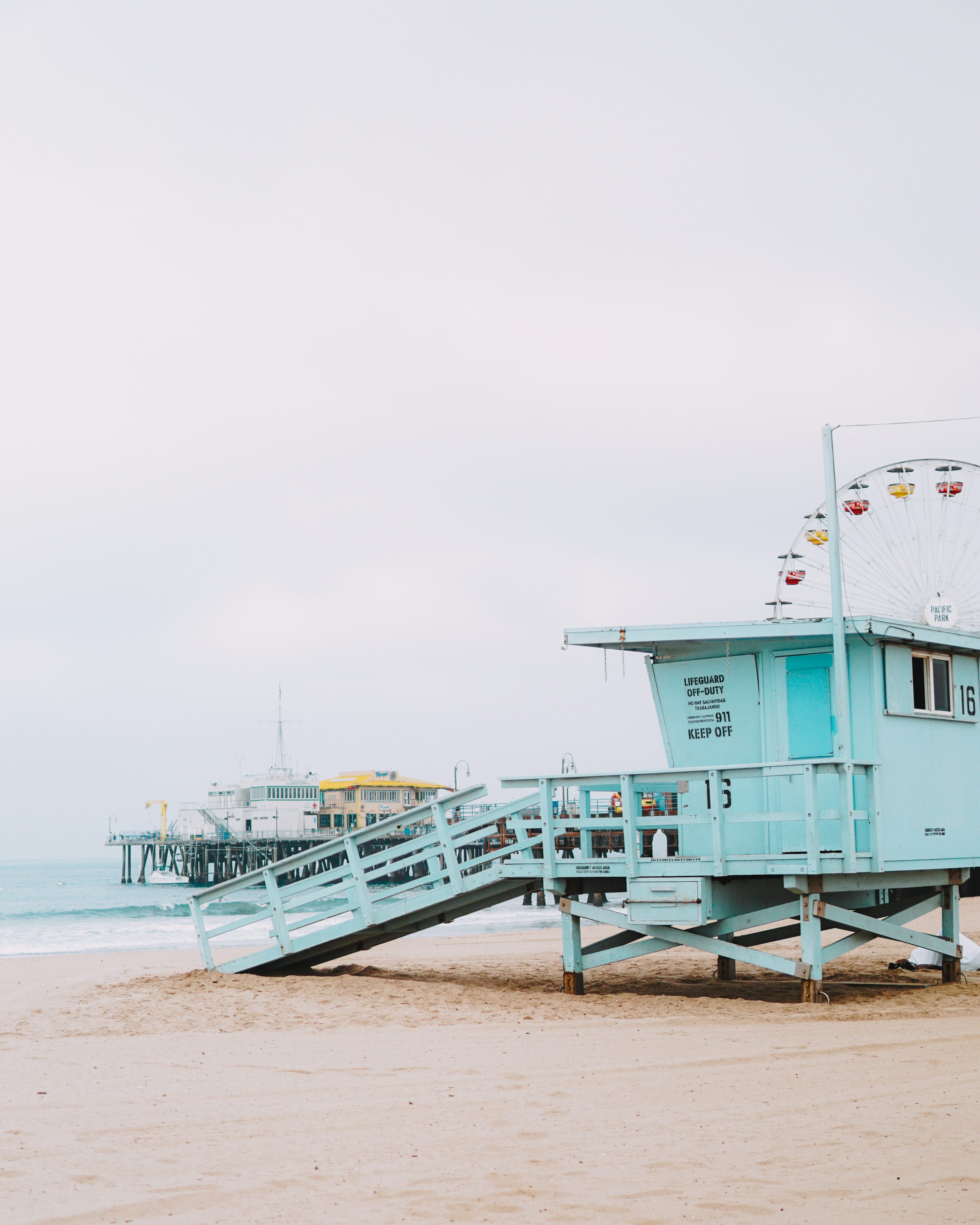 Lifeguard post on shore under white sky photo