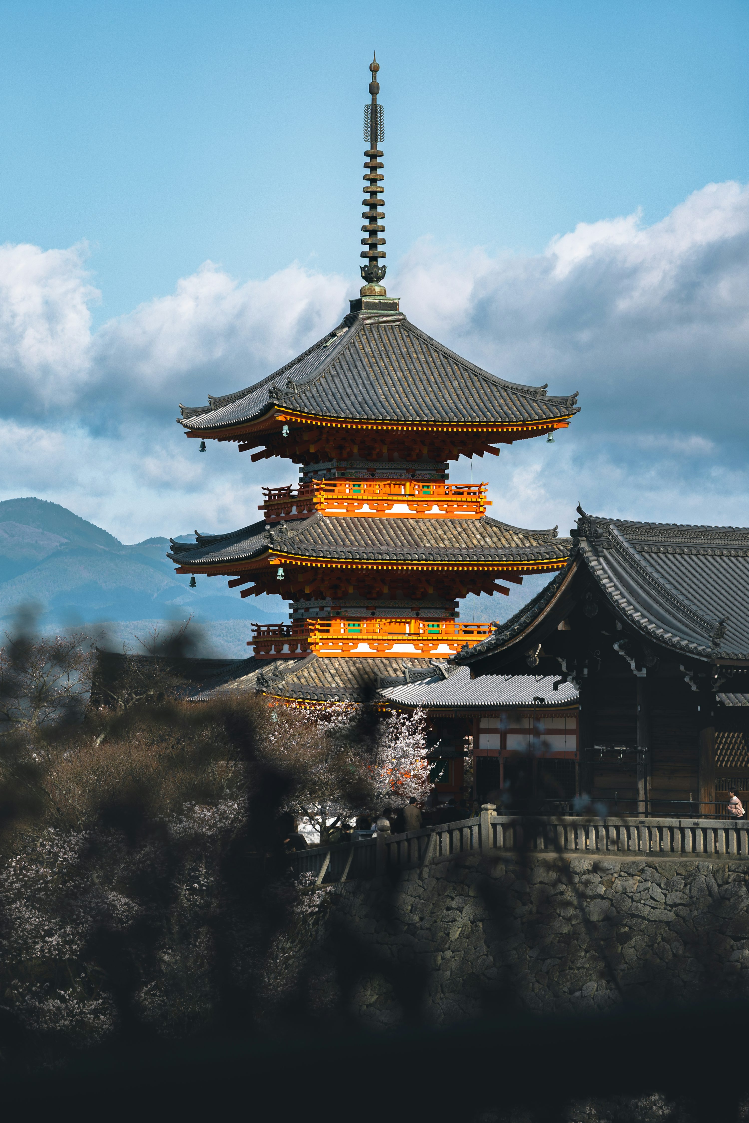 A beautiful, tiered japanese pagoda stands tall. photo