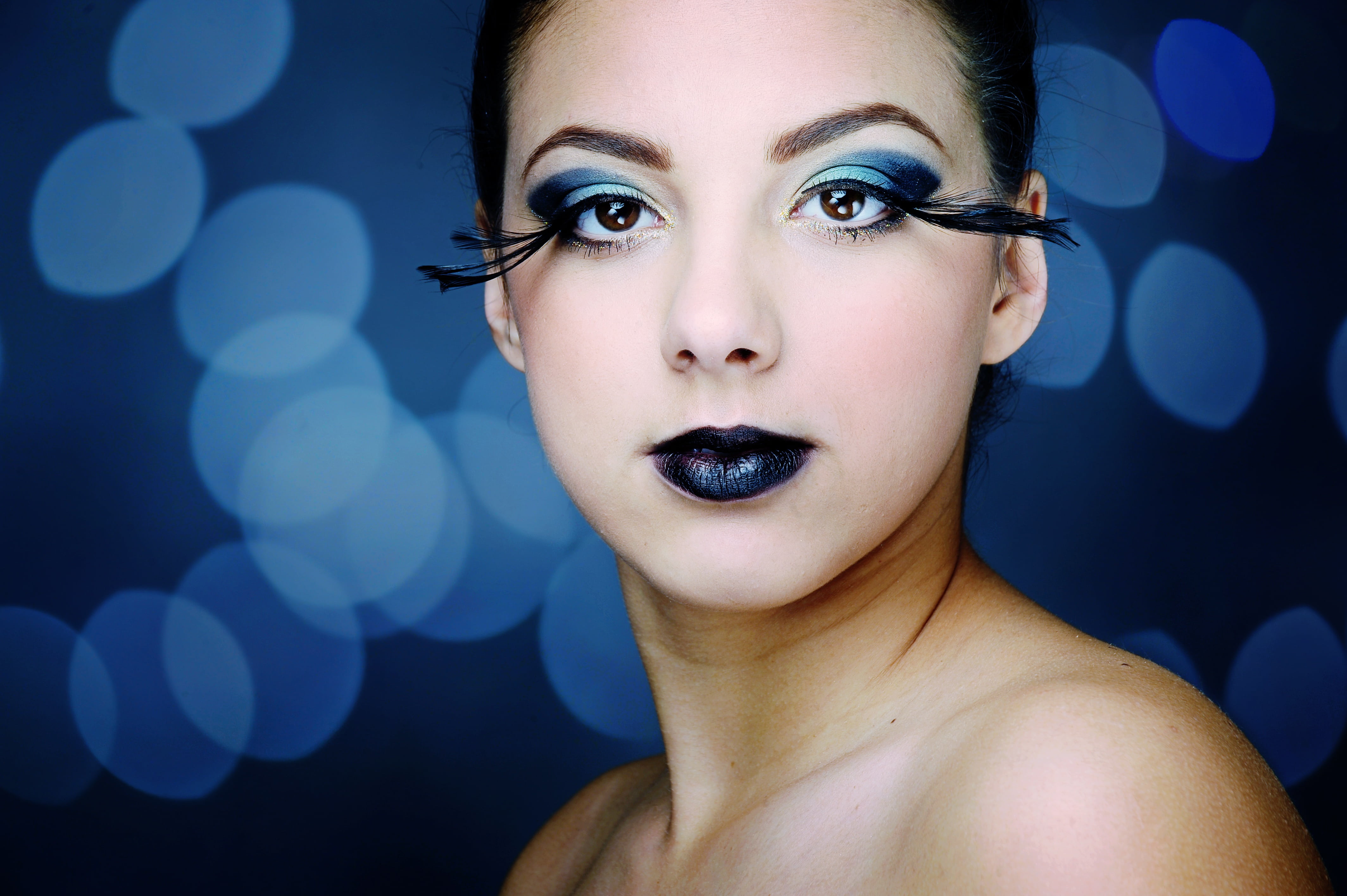 Royalty Free Photo: Woman With Blue Eyeshadow And Black Lipstick