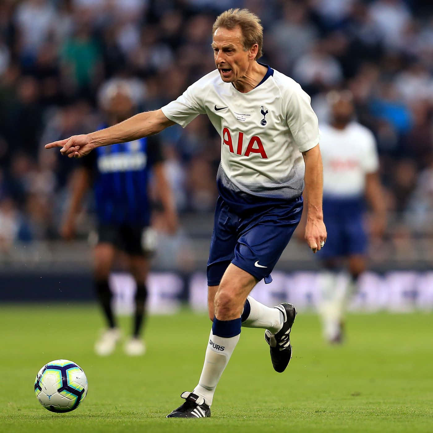 Download Jurgen Klinsmann Kicking Ball Wallpaper