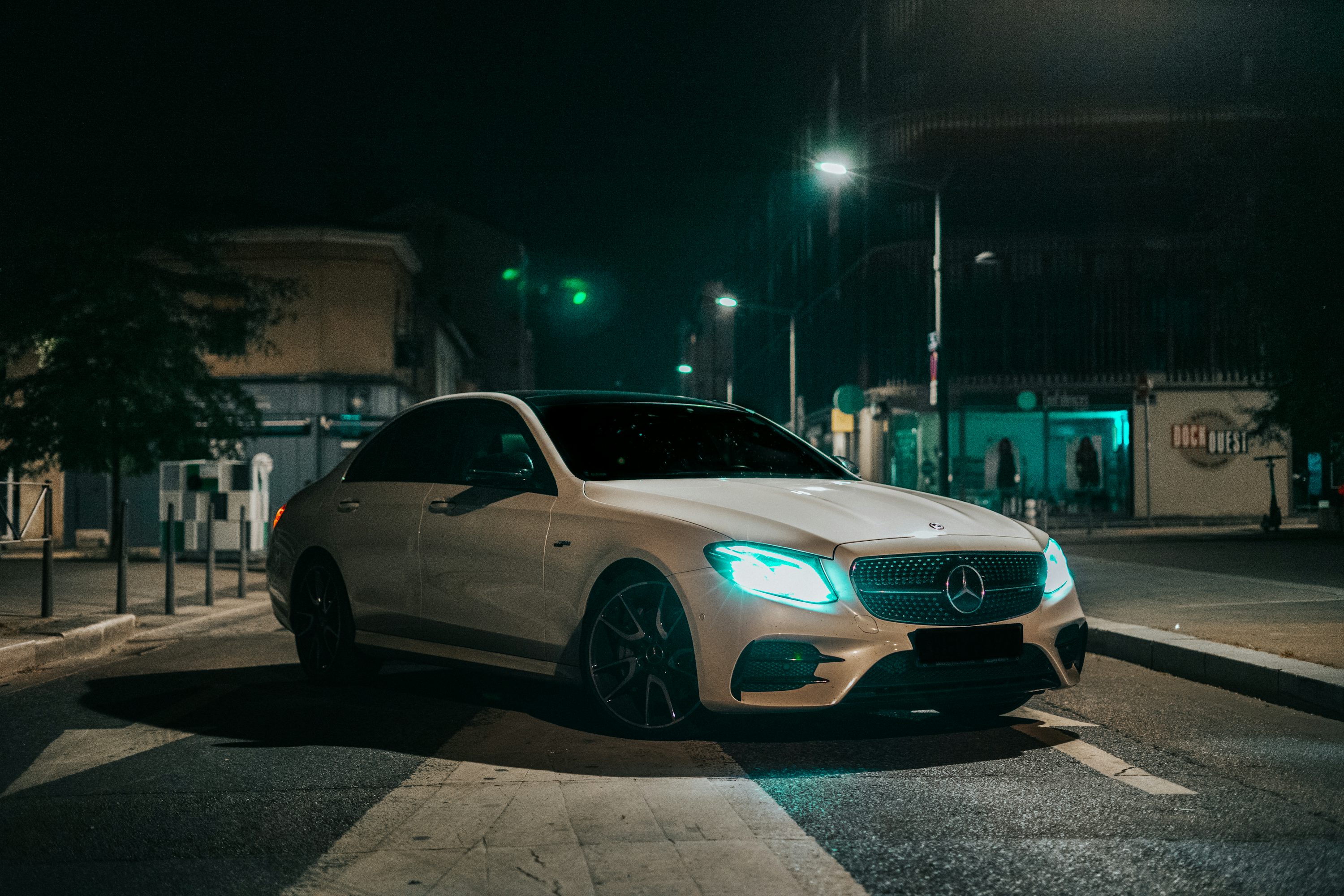 Silver mercedes coupe on road during night time photo