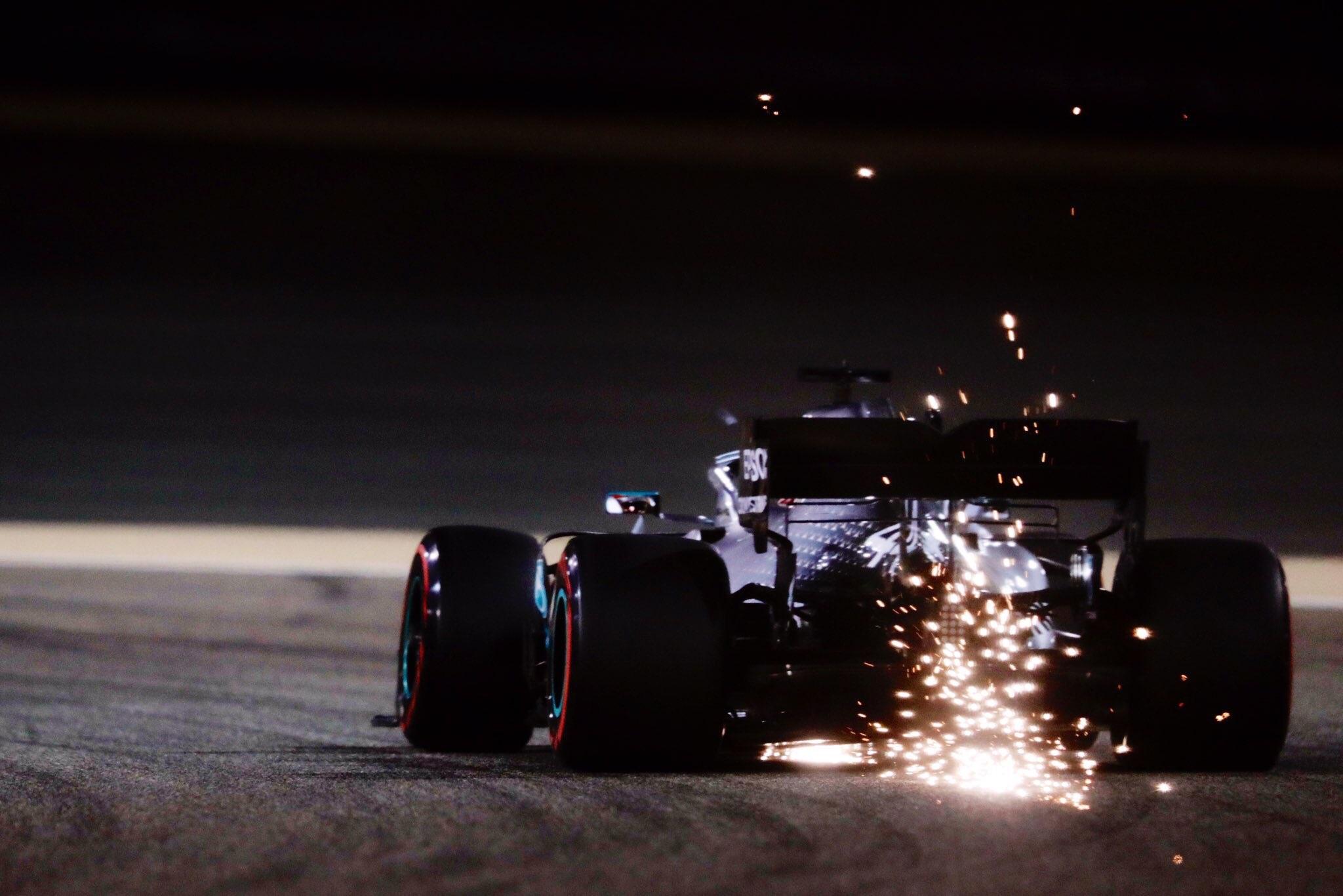 Mercedes F1 car sparking in the Bahrain night