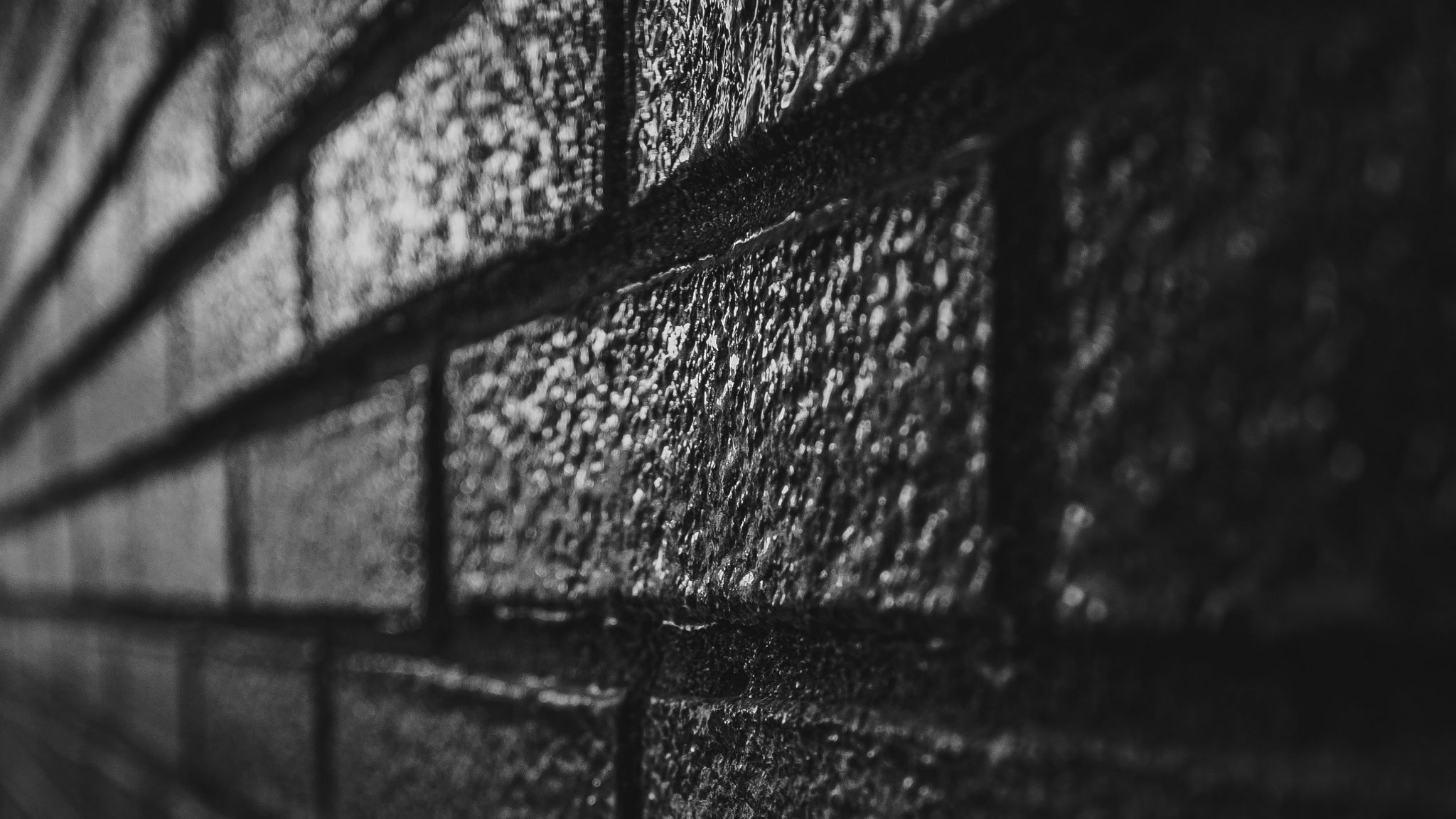 Download wallpaper 2048x1152 wall, brick, black, surface ultrawide monitor HD background