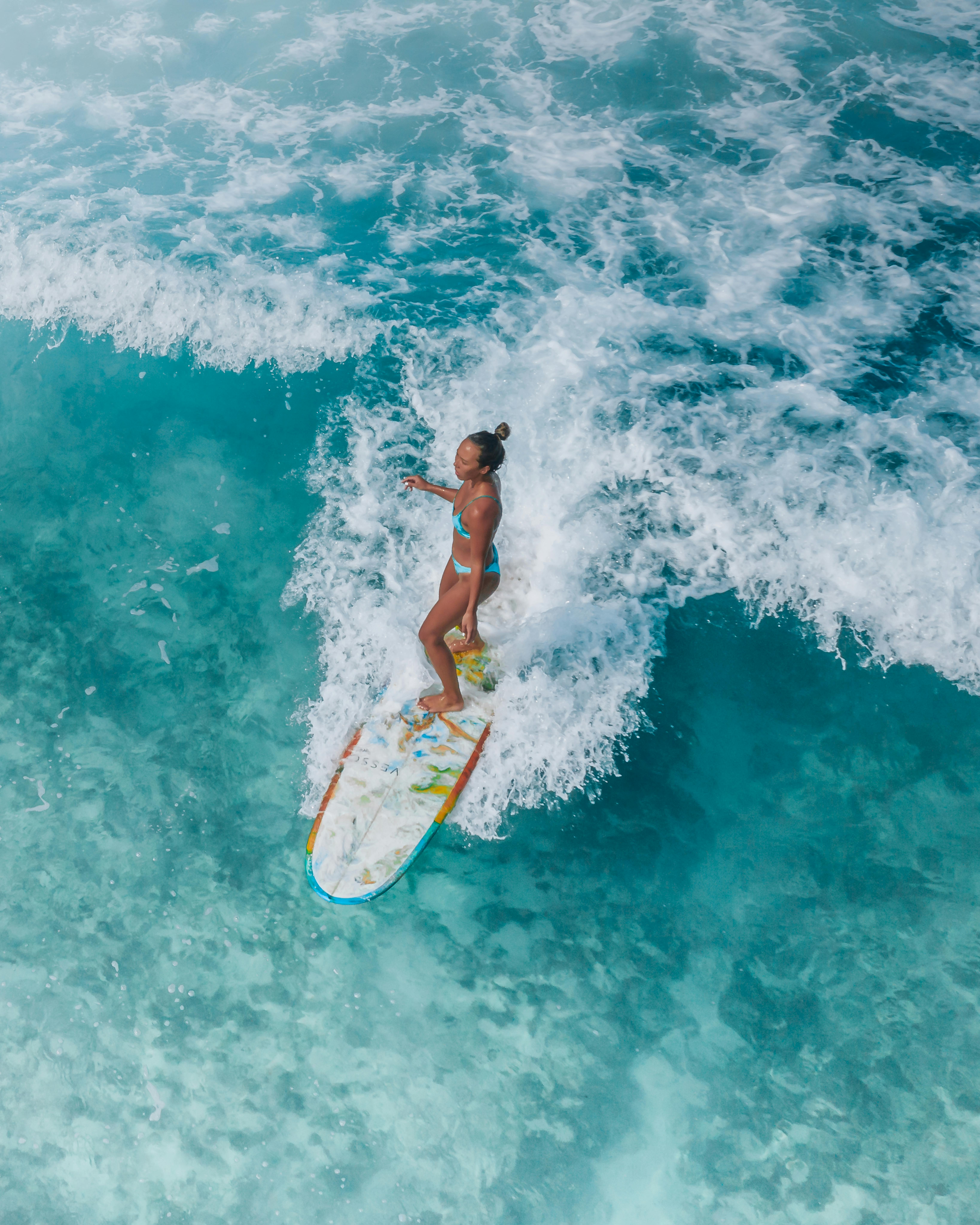 Woman Surfing in Blue Water · Free