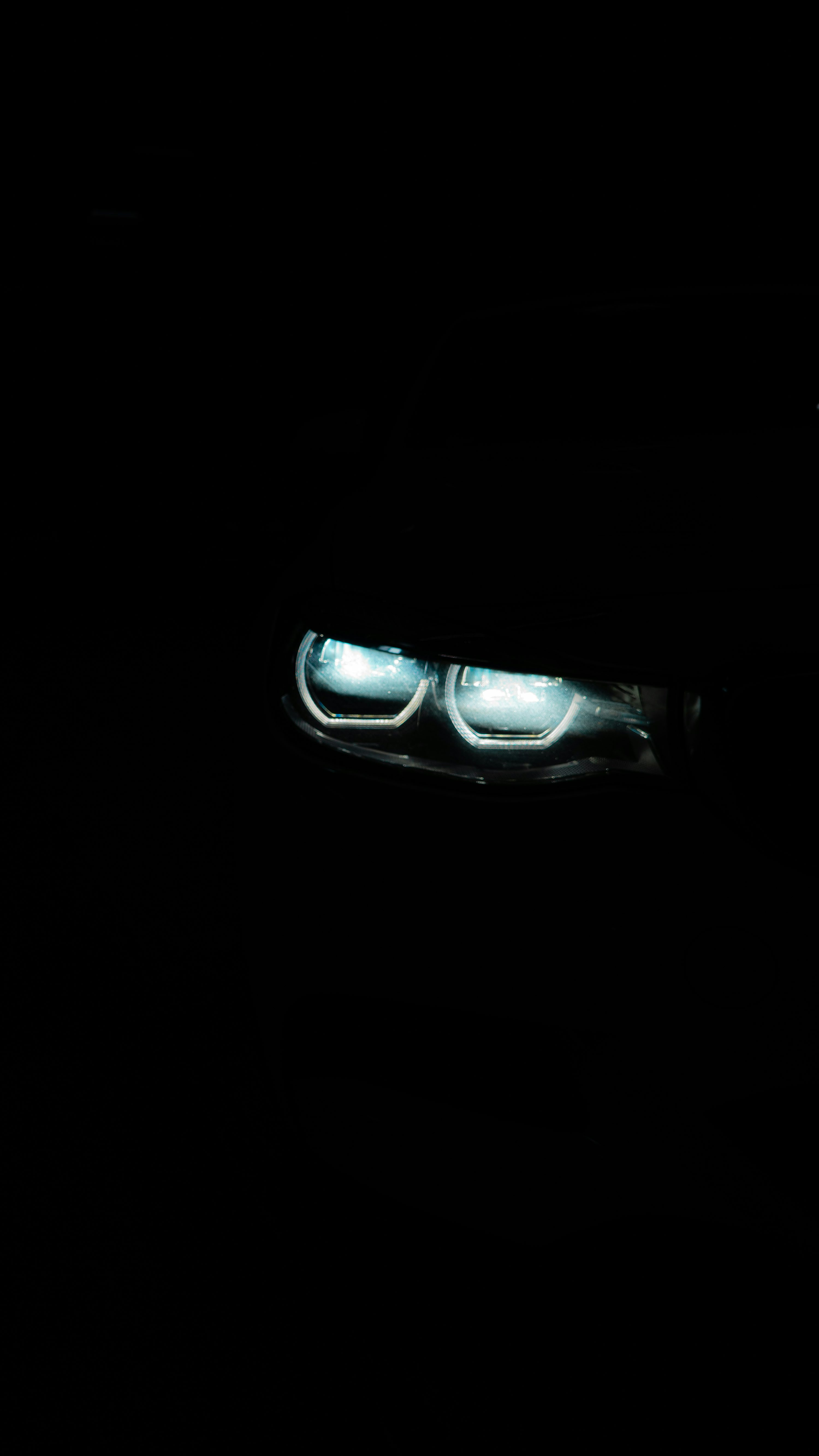 The headlights of a car in the dark photo