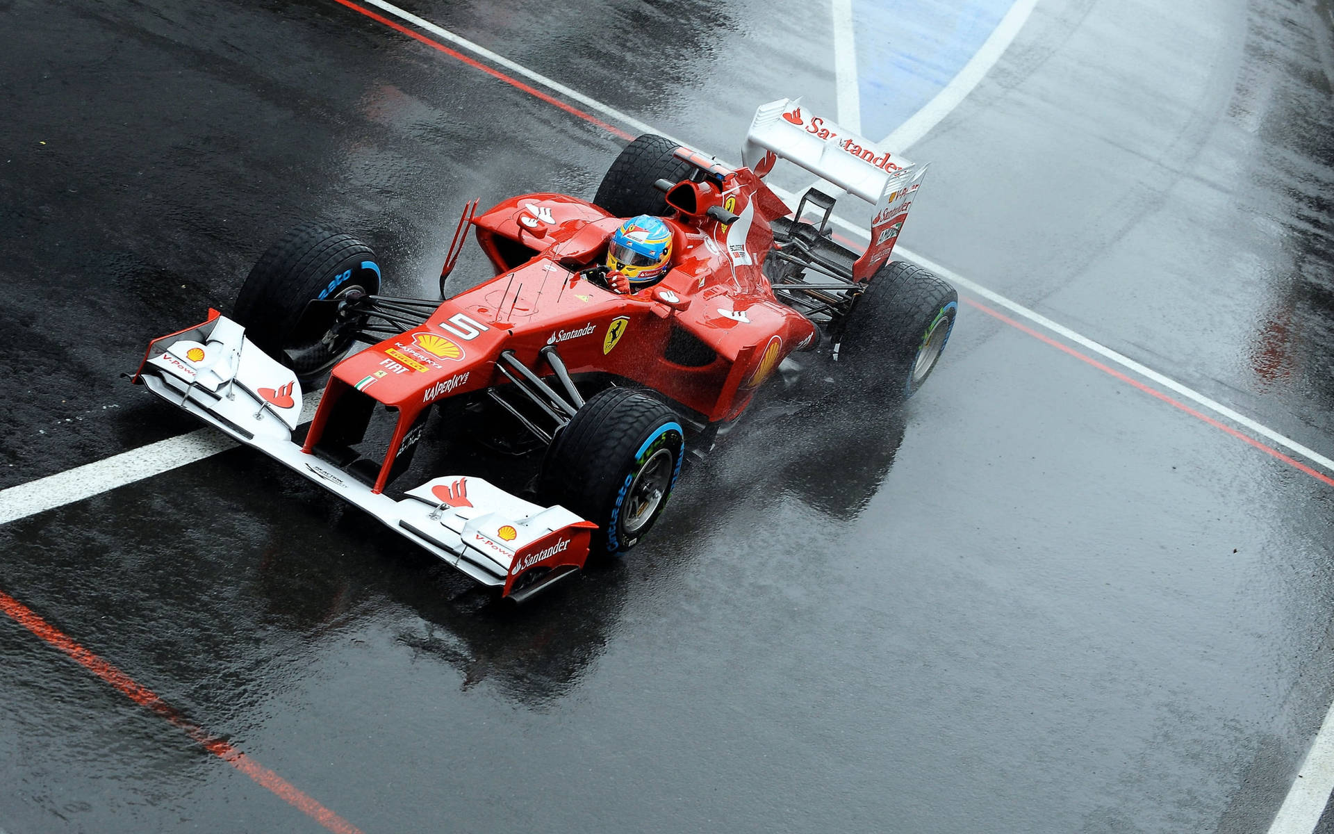 Download Fernando Alonso, Commanding the Wet Track Wallpaper