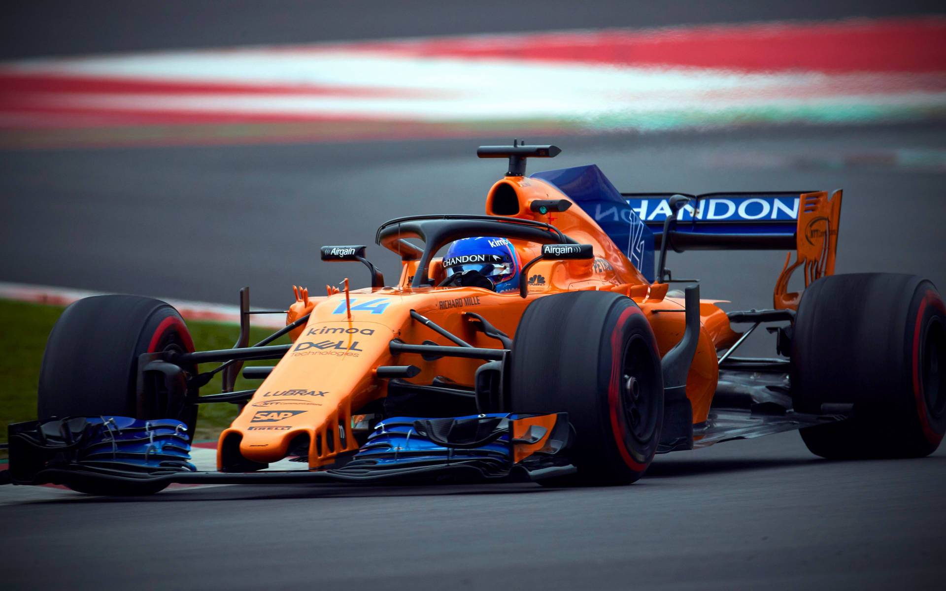 Download Caption: Fernando Alonso Racing in Orange McLaren Wallpaper