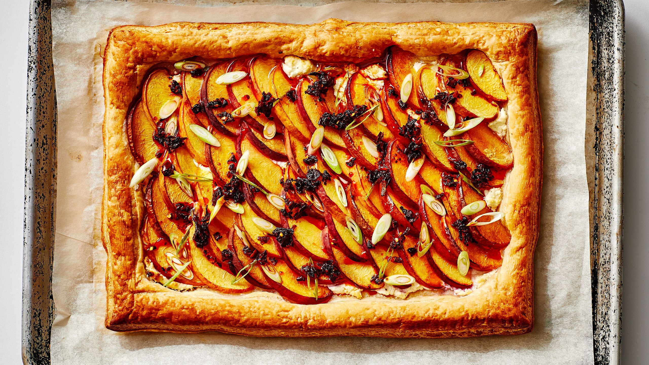 Peach Tart? Good. Chili Crisp Peach Tart? Even Better. Bon Appétit