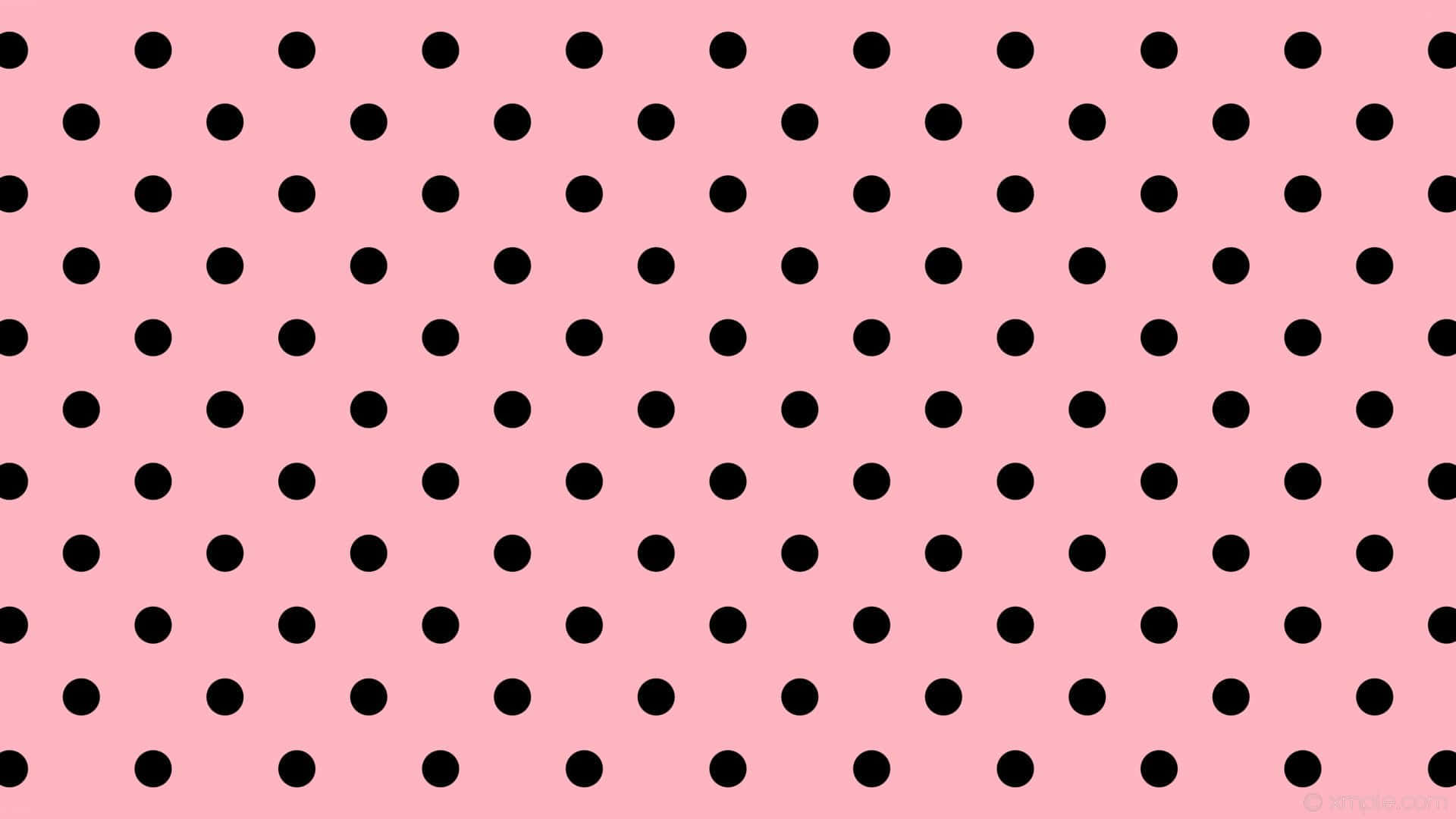 Download A fun and whimsical pink polka dot pattern