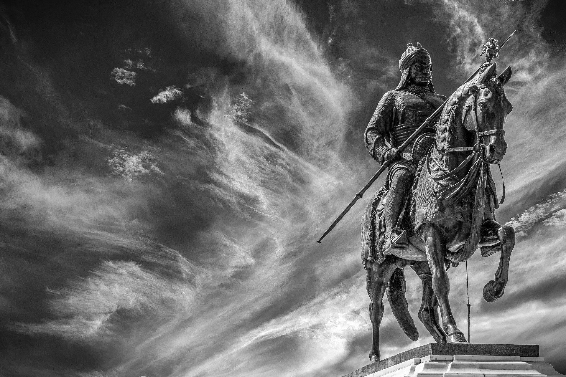 Warrior Statue Under Stormy Skies: HD Wallpaper by Aamir Mohd Khan