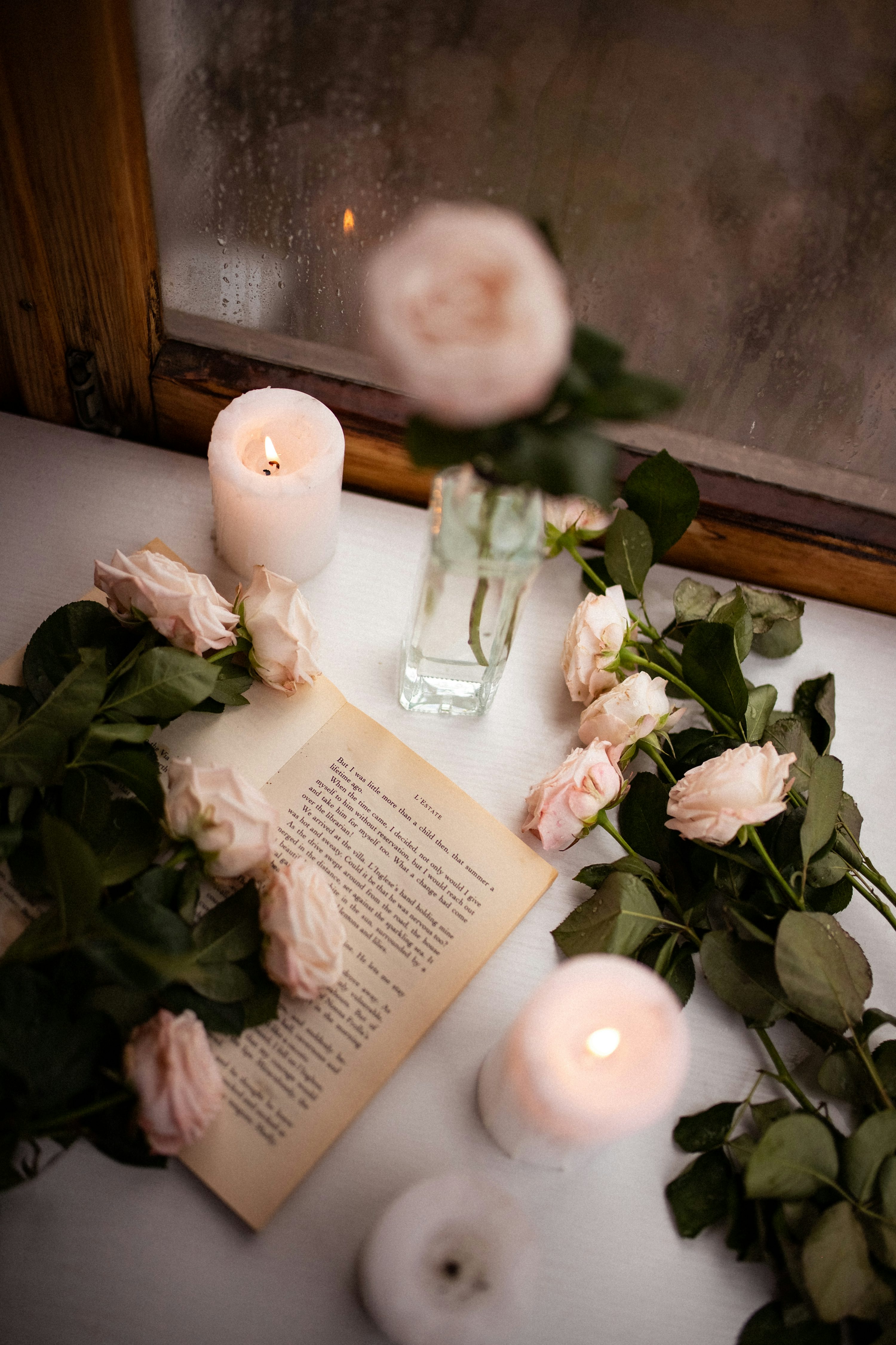 A book and some flowers on a table photo