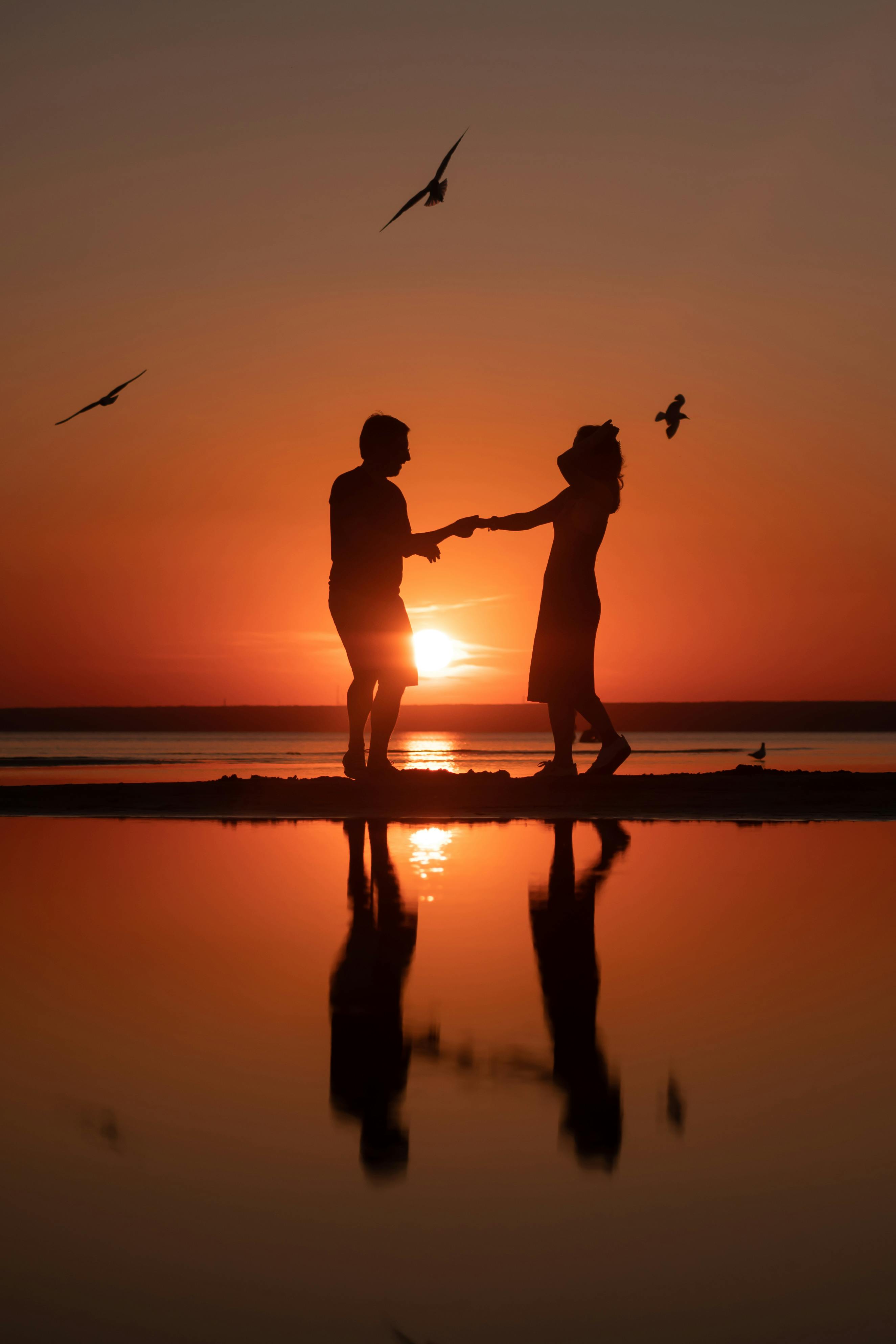 Silhouettes of a Couple at Sunset · Free