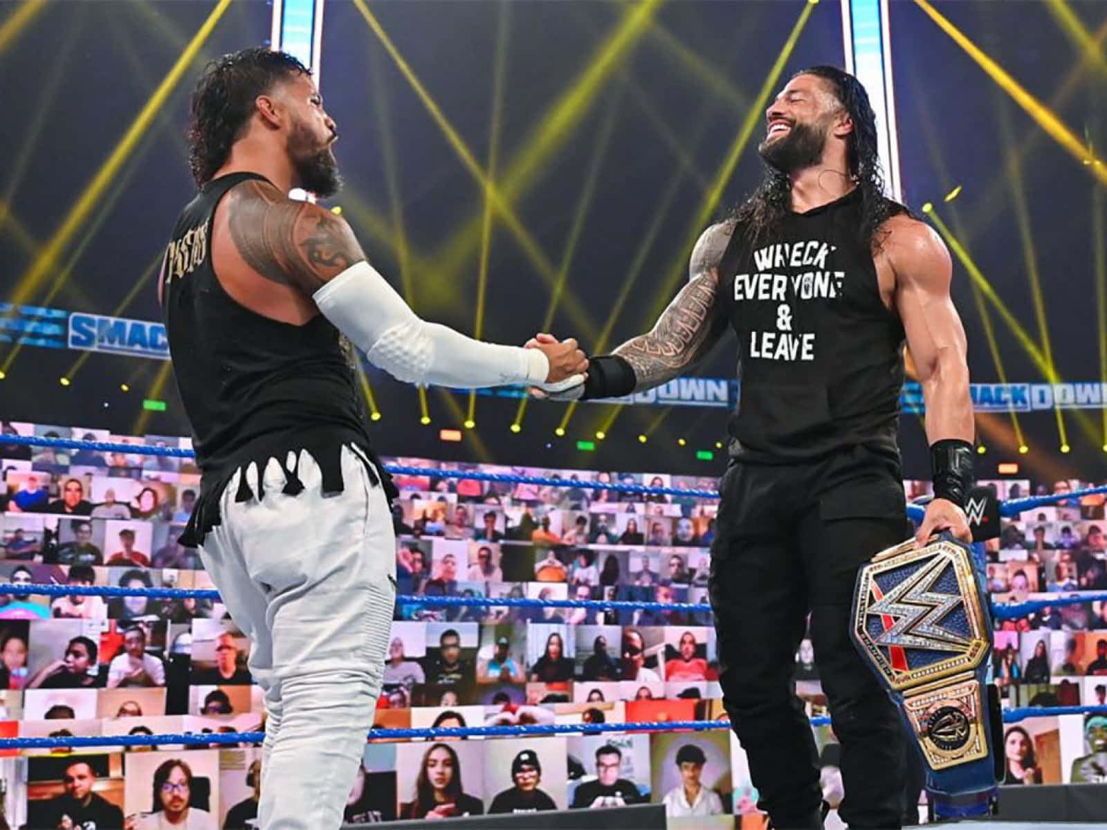 Download Jey Uso And Roman Reigns Handshaking Wallpaper