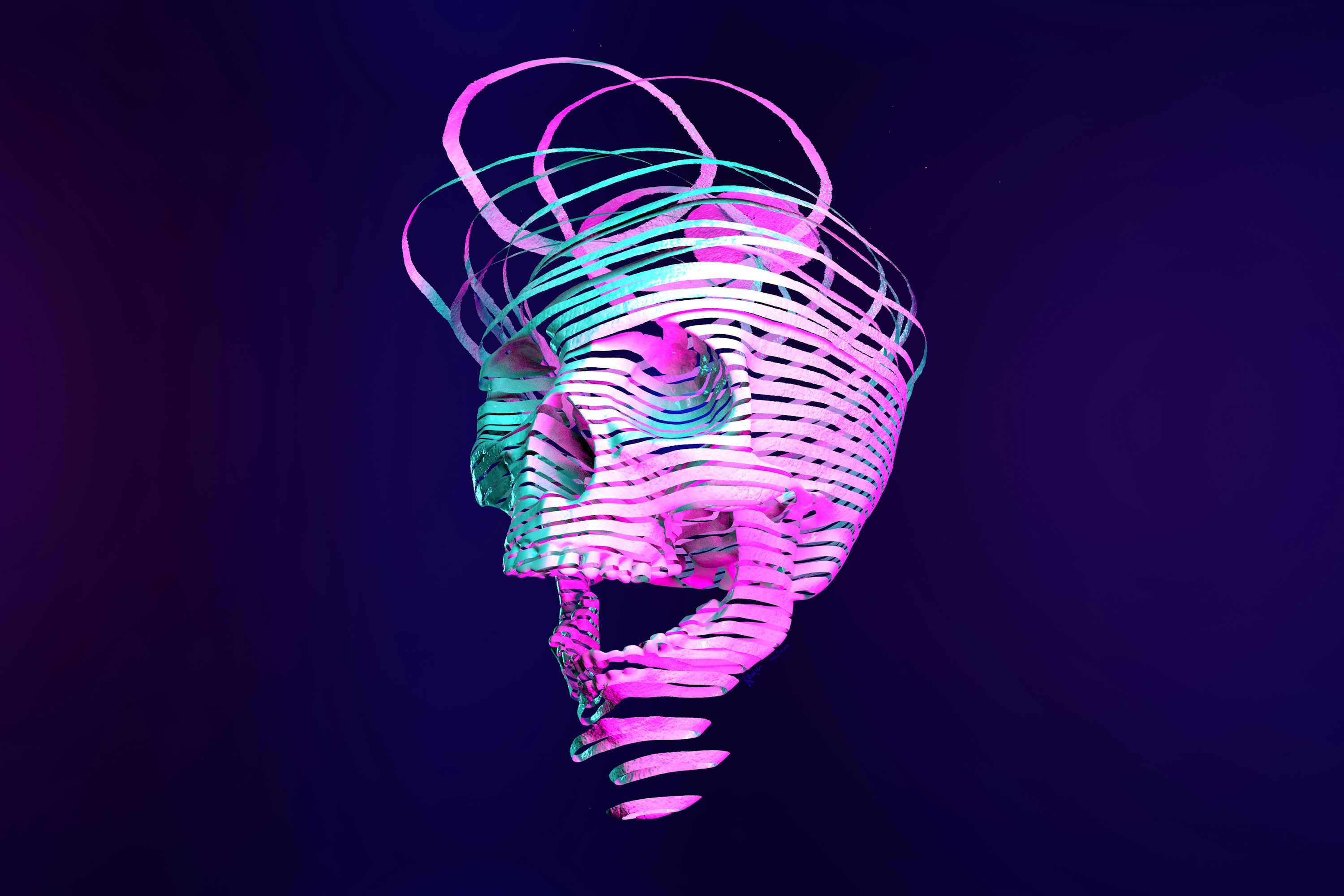 A neon skull is shown against a dark background photo