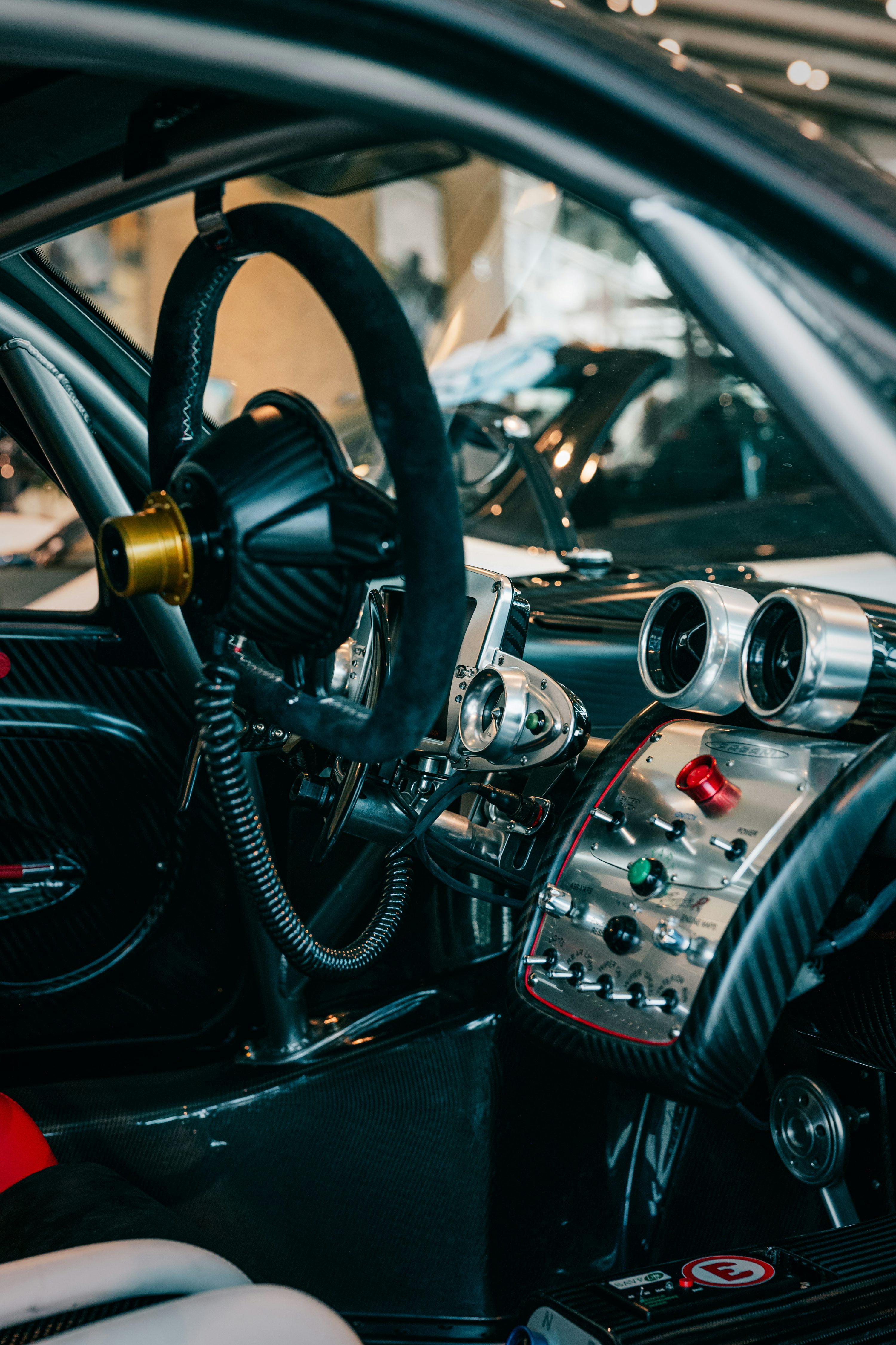 The interior of a car with a steering wheel and dashboard photo