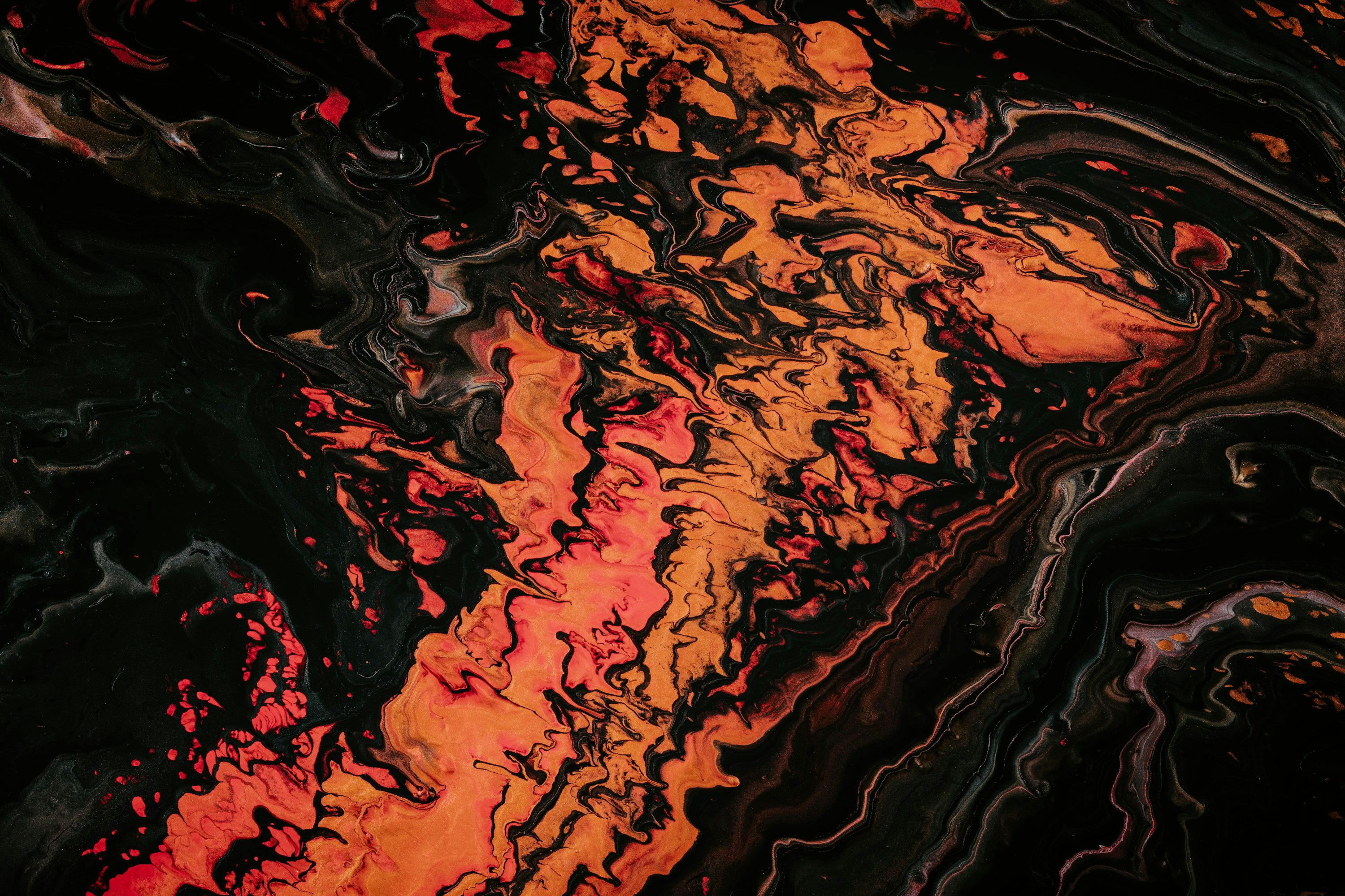 Orange and black fluid abstract painting photo