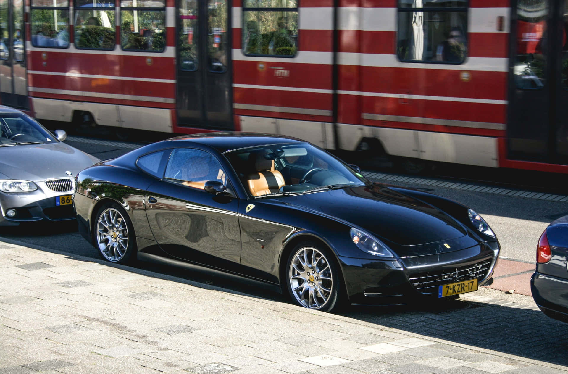 Download Stunning Red Ferrari 612 Scaglietti on the Road Wallpaper