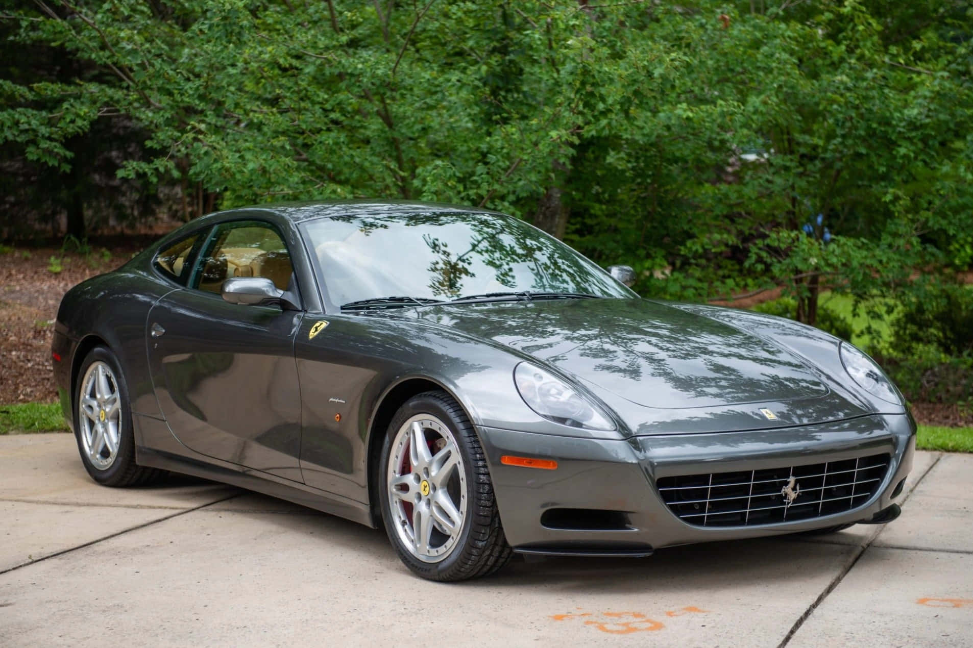 Download Stunning Red Ferrari 612 Scaglietti on Open Road Wallpaper