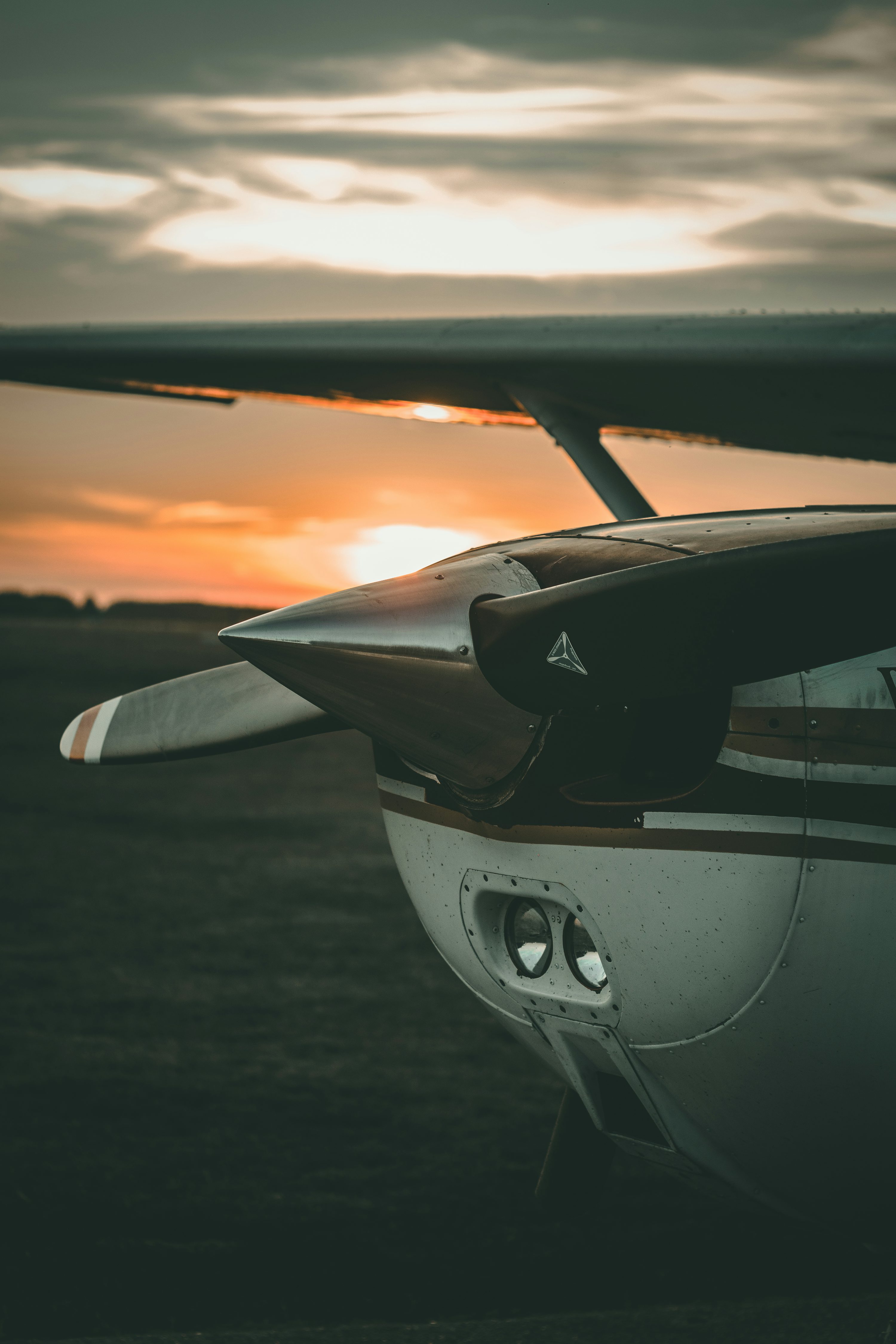 Close Up Photography Of Brown And White Plane During Sunrise Photo