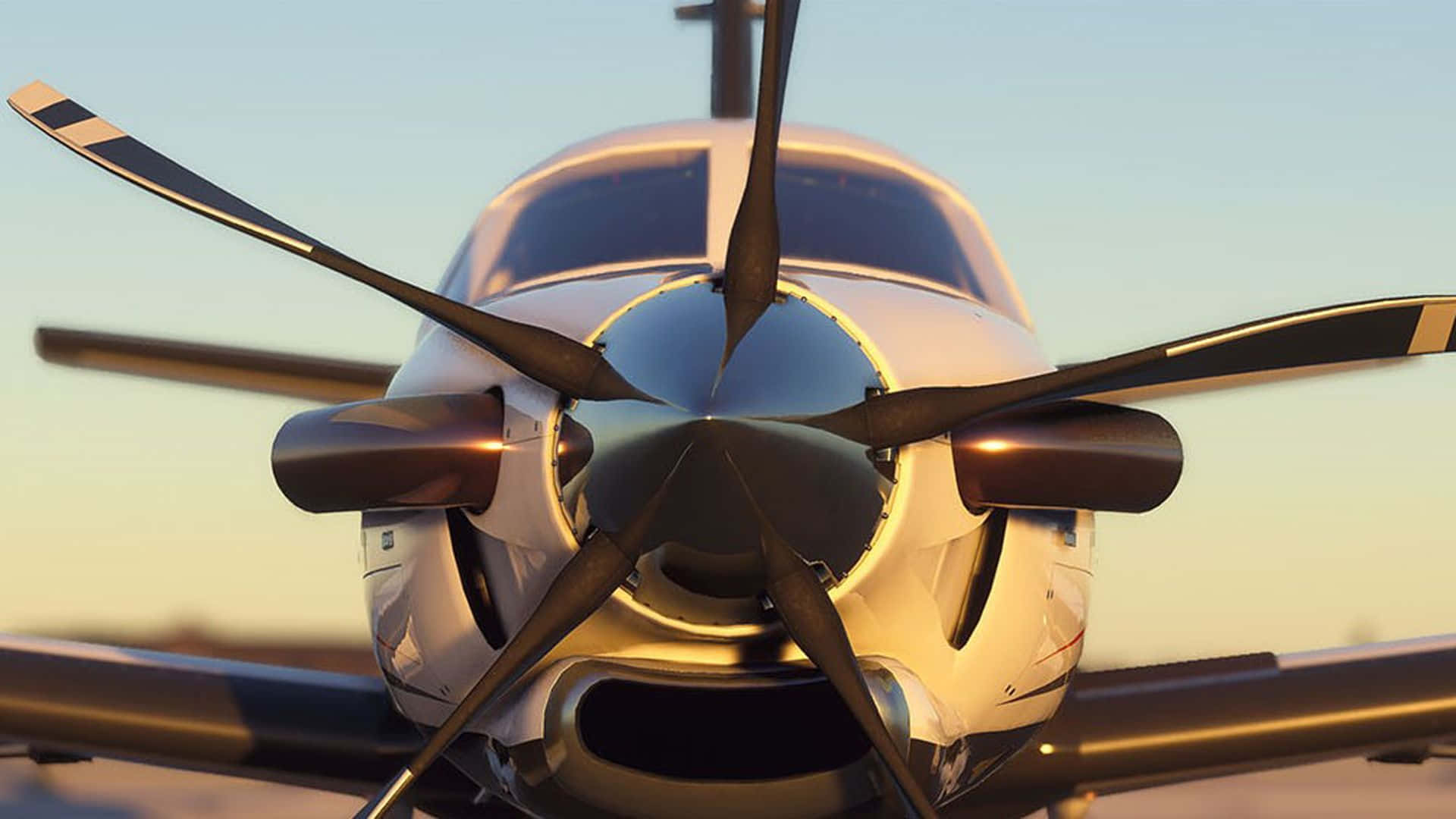 Download A Propeller On A Plane Parked On The Runway