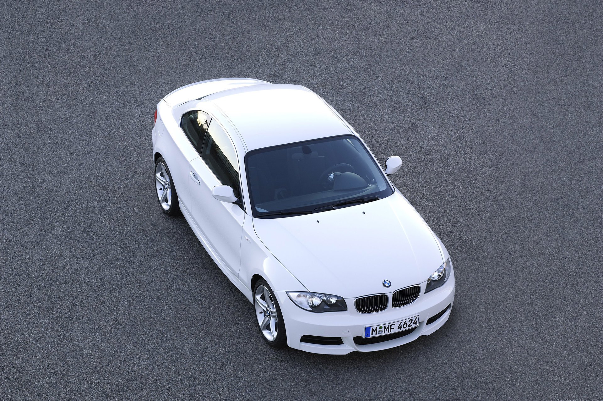 White BMW car on asphalt top view for your phone