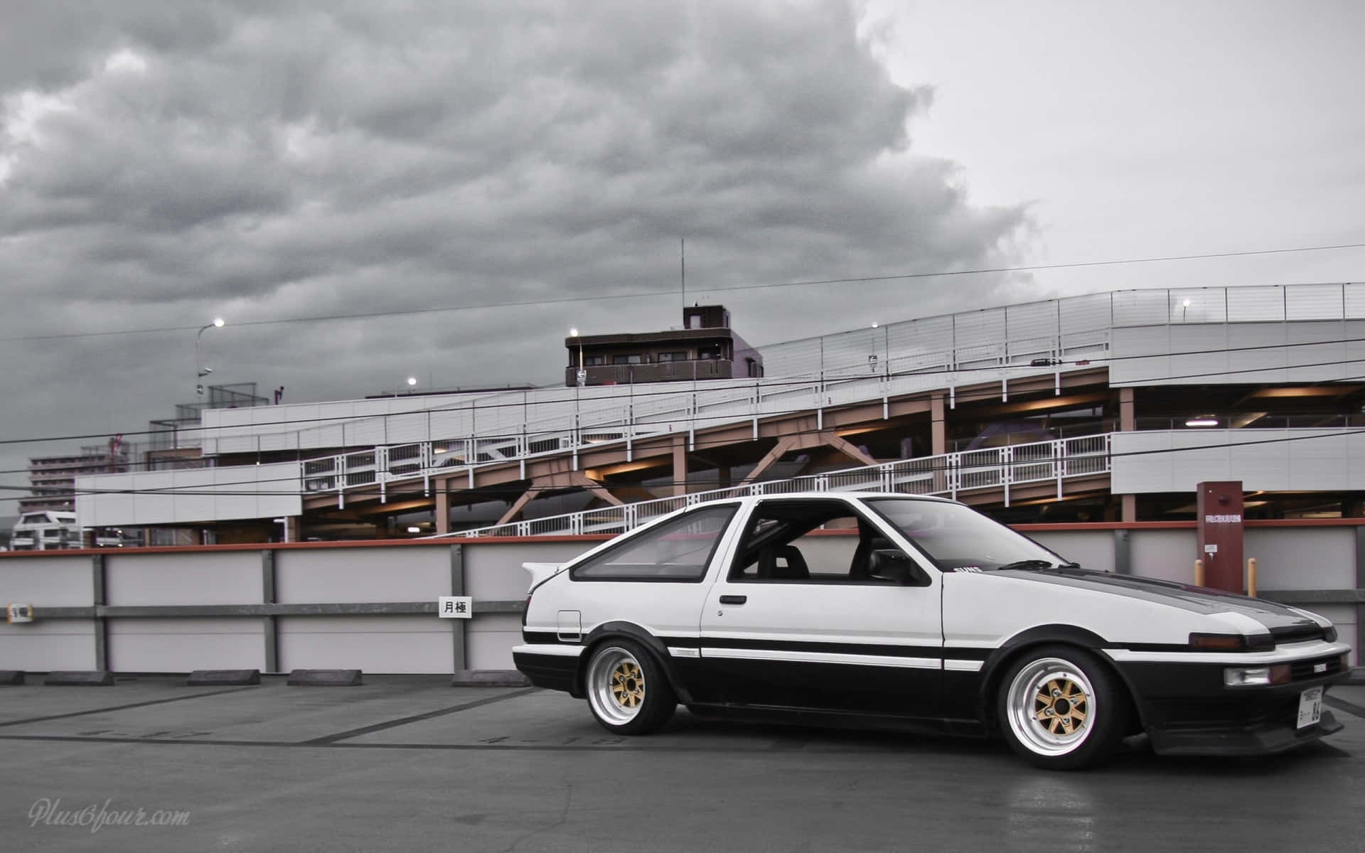 Download An iconic Toyota AE86 framed against a beautiful skyline Wallpaper