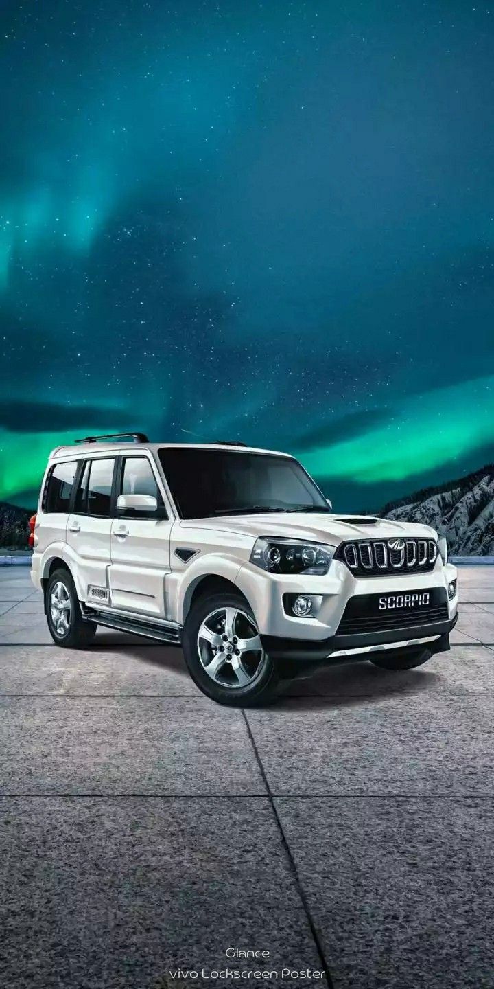 SUV Parked In Front Of Aurora Filled Sky With Green Lights